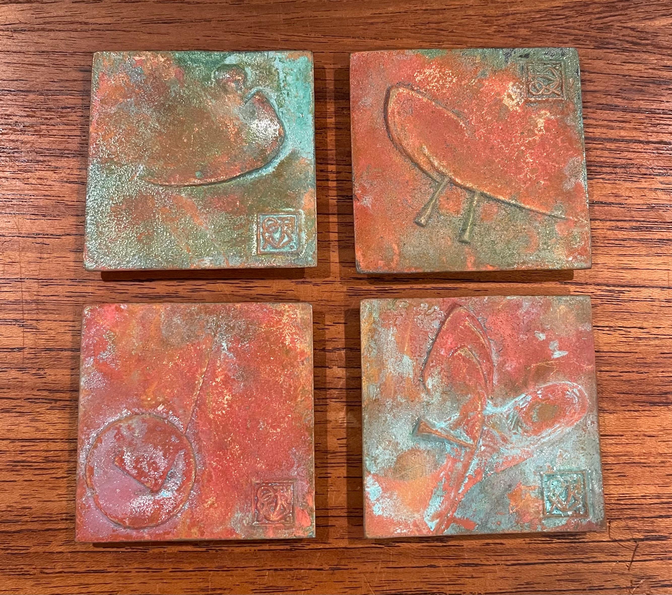 Set of four bronze Cosanti tiles by Paolo Soleri, circa 1990s. The tiles measure 2.5