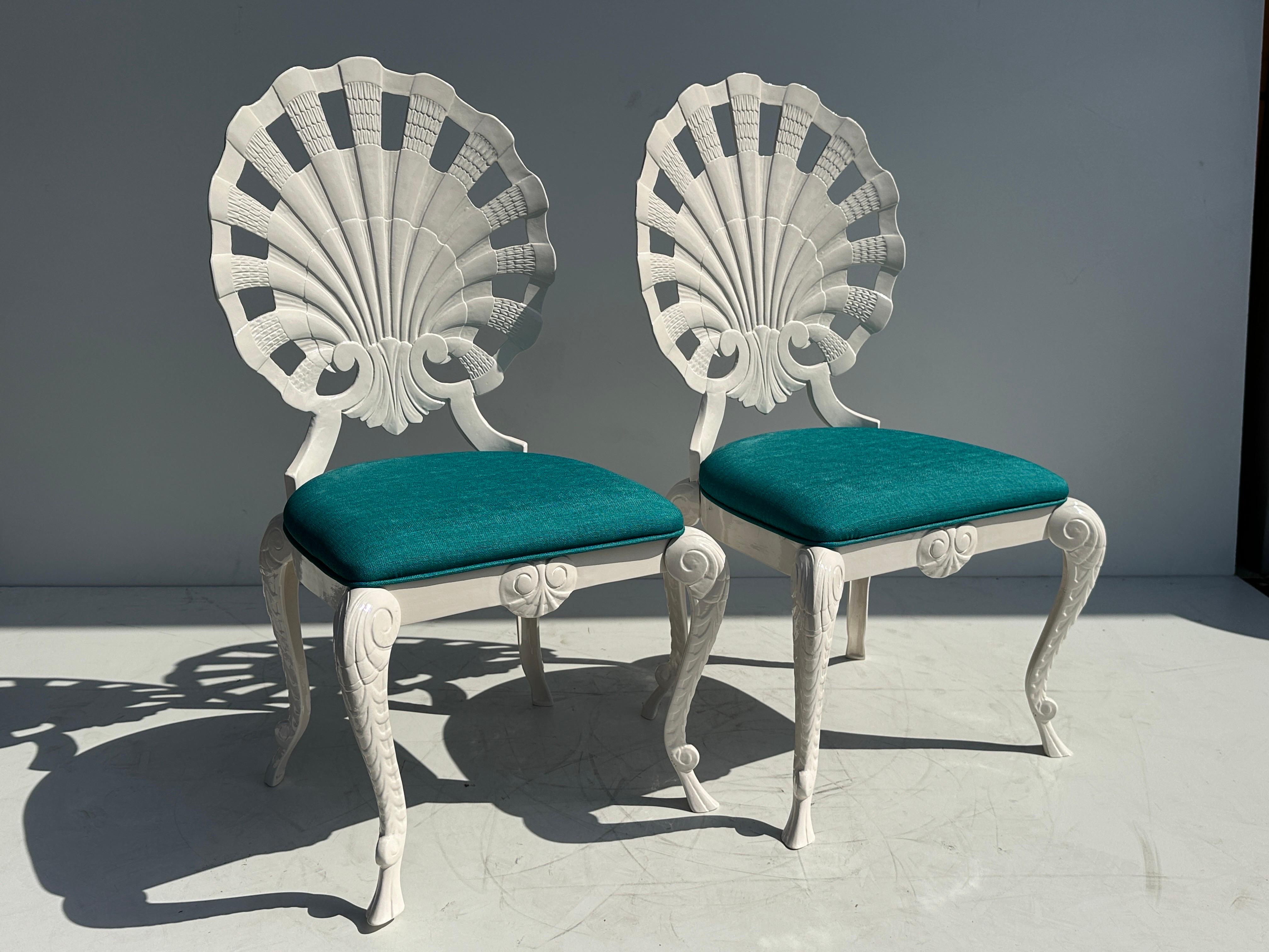 Set of four Brown Jordan Grotto style cast aluminum shell back chairs newly powder coated in light cream color and upholstered in funky mid century vinyl seats.