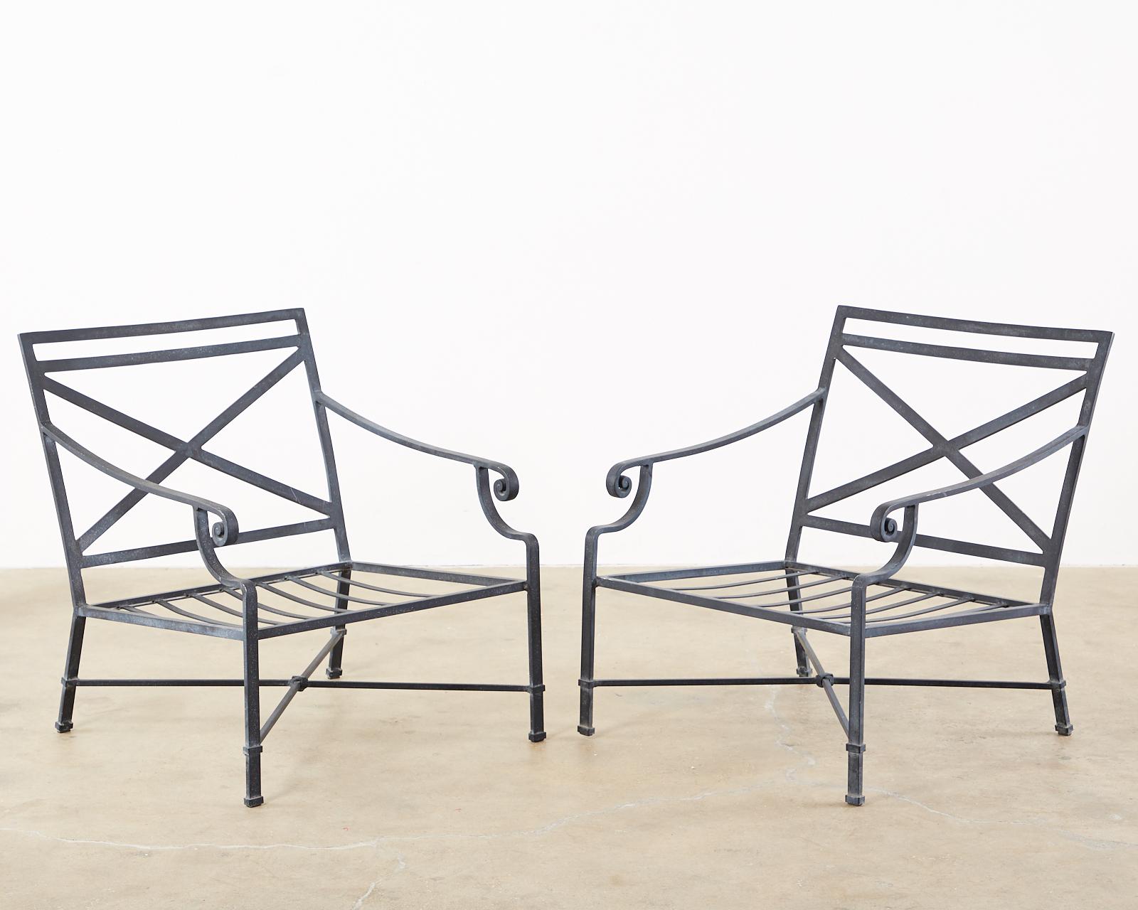 Set of four aluminum patio and garden lounge chairs made by Brown Jordan. All armchairs made of wrought aluminum with a multi-step powder coated finish. The black patina has very faint silver and gold flecks on the finish. Known as Brown Jordan's