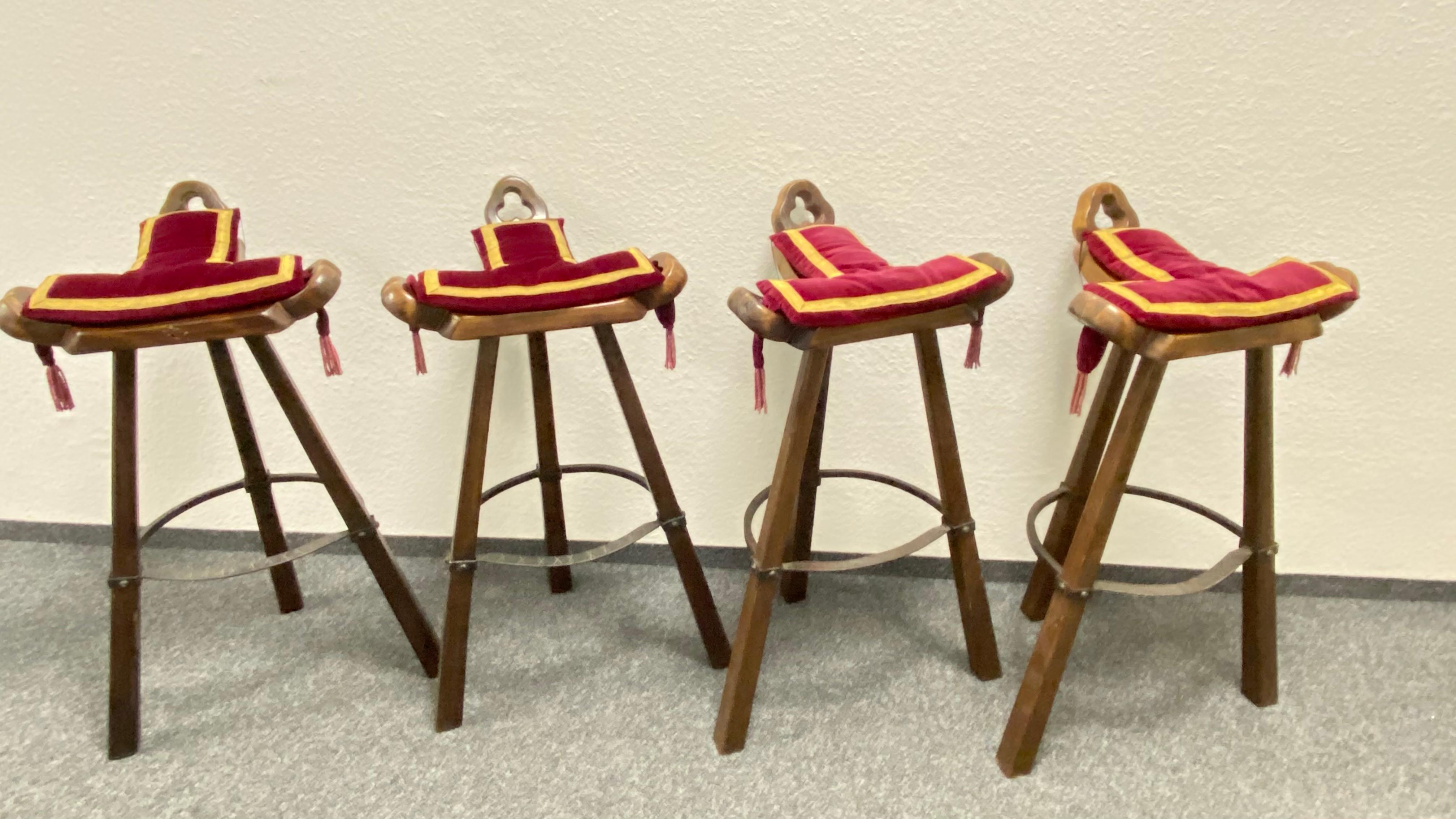 A gorgeous set of Brutalist bar stools. Set of four 'Brutalist' or 'Marbella' bar stools, in wood and metal, Spain, 1970s. A curved T-shape with three handles. The curved form makes sure the stool has a stabile seat, emphasized by the metal ring as