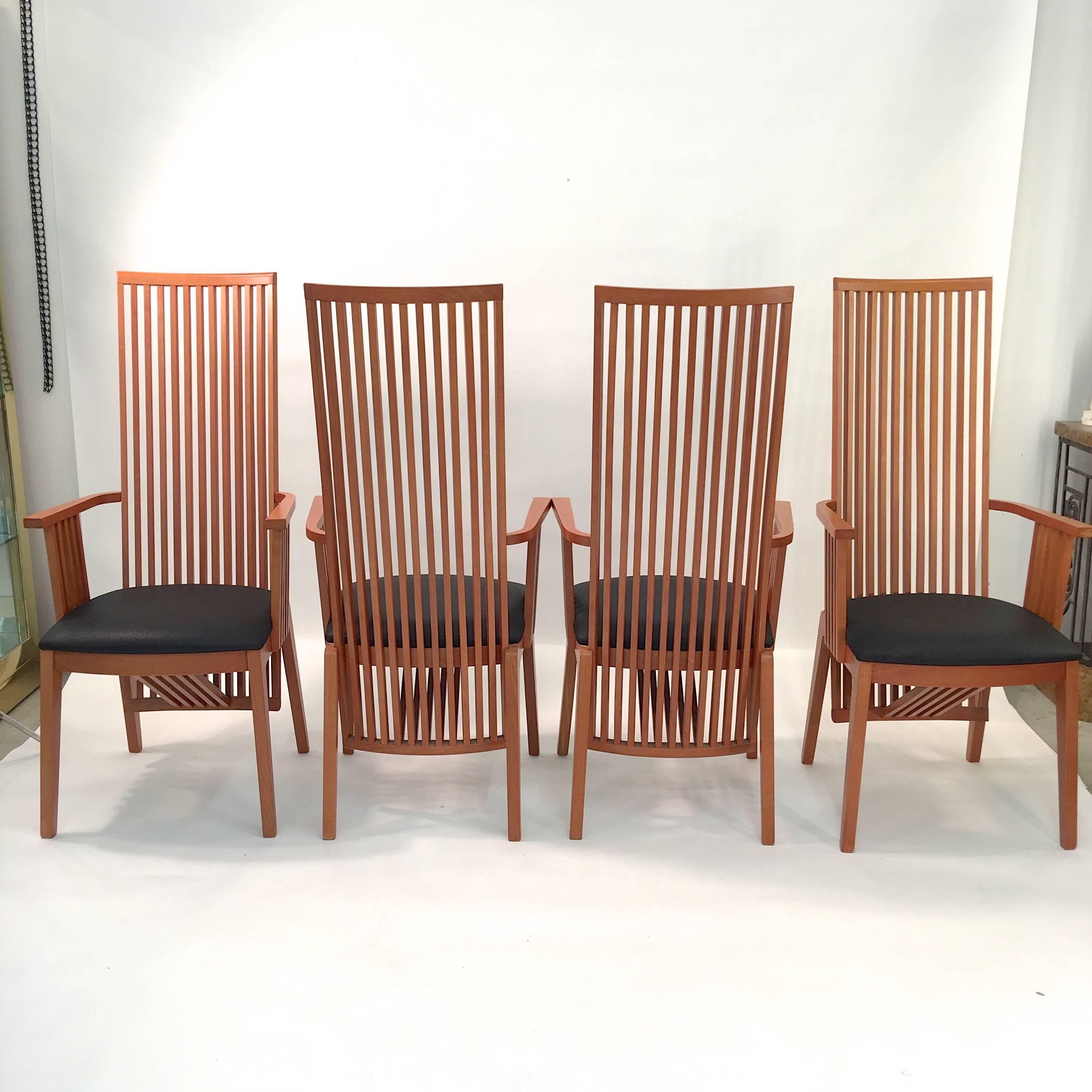 Set of four dining armchairs in the style of Frank Lloyd Wright by A. Sibau produced in Manzano, Italy

Made of beechwood with cherry finish with black leather seats.

Pristine condition.
