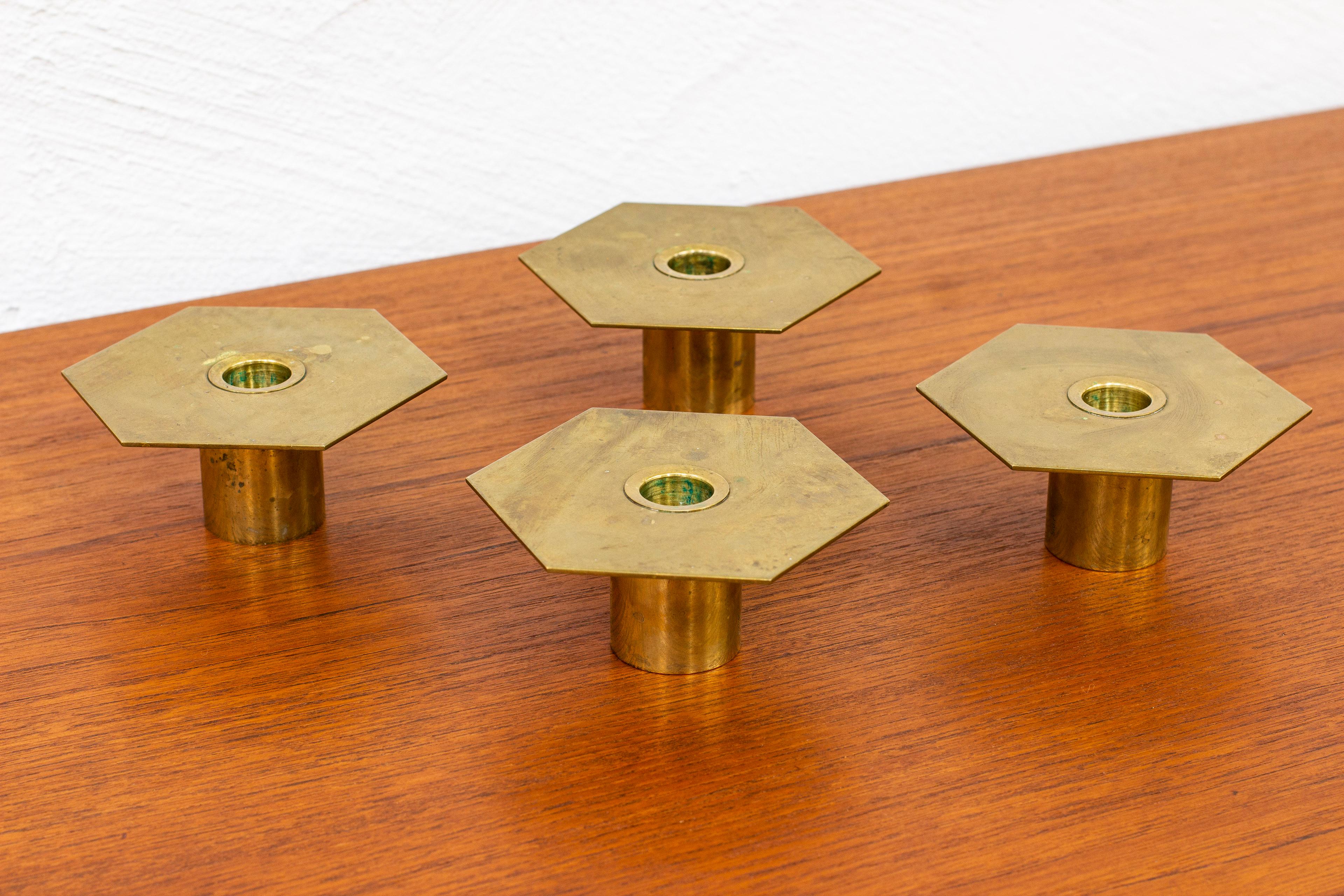Set of four candlesticks designed and made by Sigurd Persson. Made from solid brass. Produced during the 1980s. Very good vintage condition with few signs of age related wear and patina.
 
Price for the set of four.

Dimensions: W. 11 D. 11 H. 5