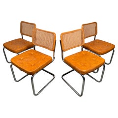 Set of Four Cantilever Rattan Dining Chairs by Chromcraft
