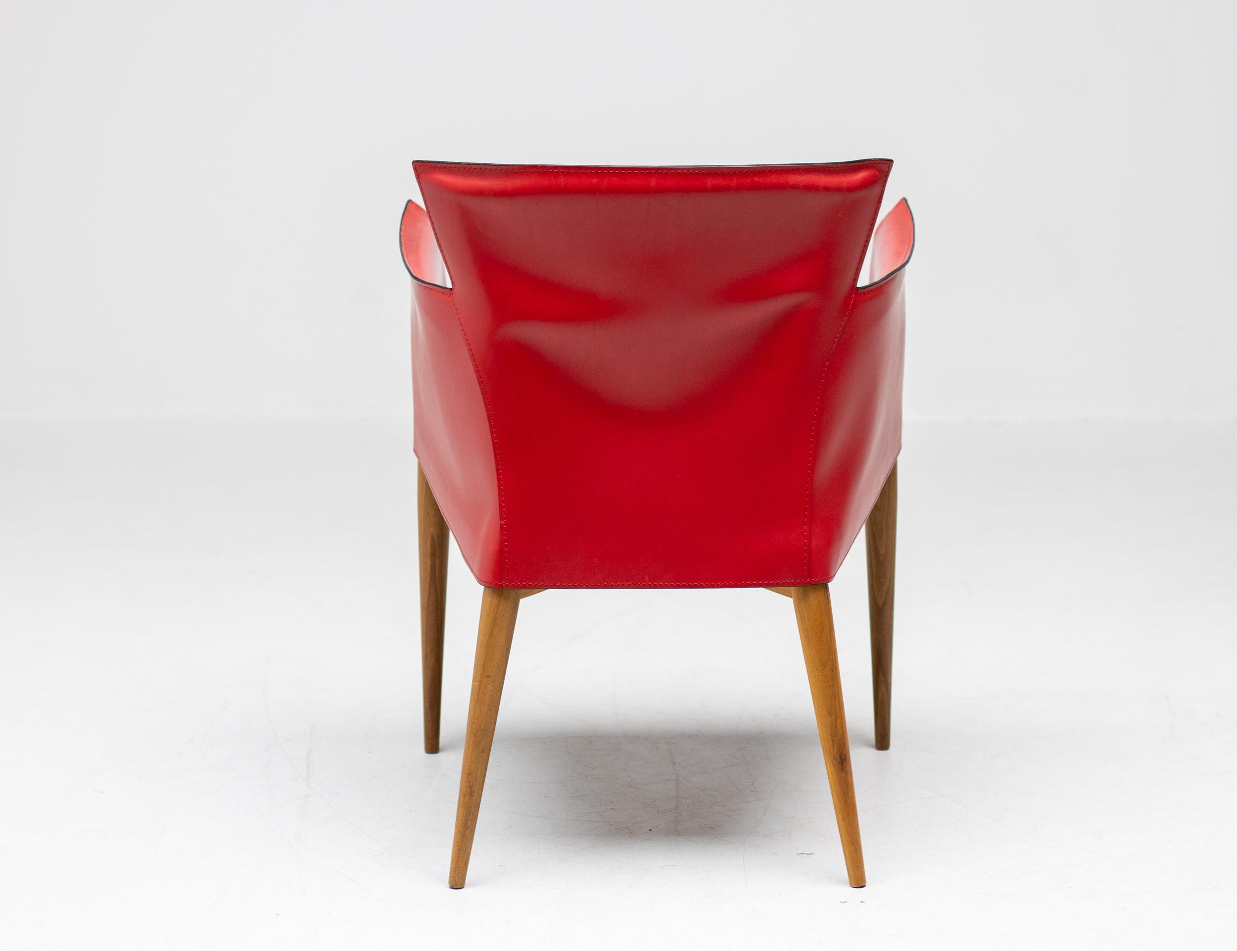 Rare Carlo Bartoli for Matteo Grassi Vela armchairs in red Italian leather, made in Italy, circa 1980.
High-end chair consisting of handstitched leather upholstery wrapped over an internal walnut frame. 
The design of this chair is inspired by how