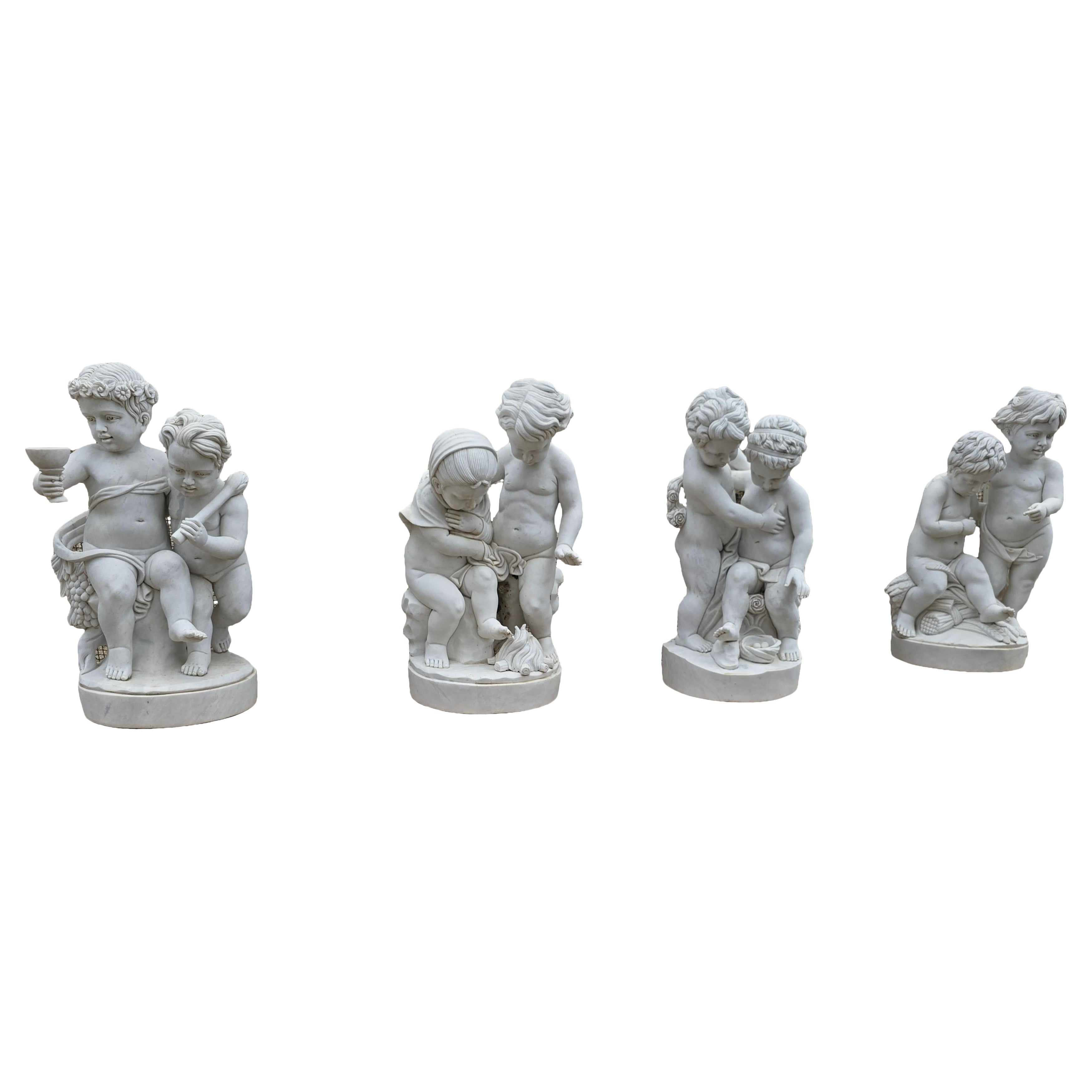 Set of Four Carrara Marble Cherub Sculptures on Red Marble Bases, Italy For Sale
