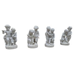 Set of Four Carrara Marble Cherub Sculptures on Red Marble Bases, Italy