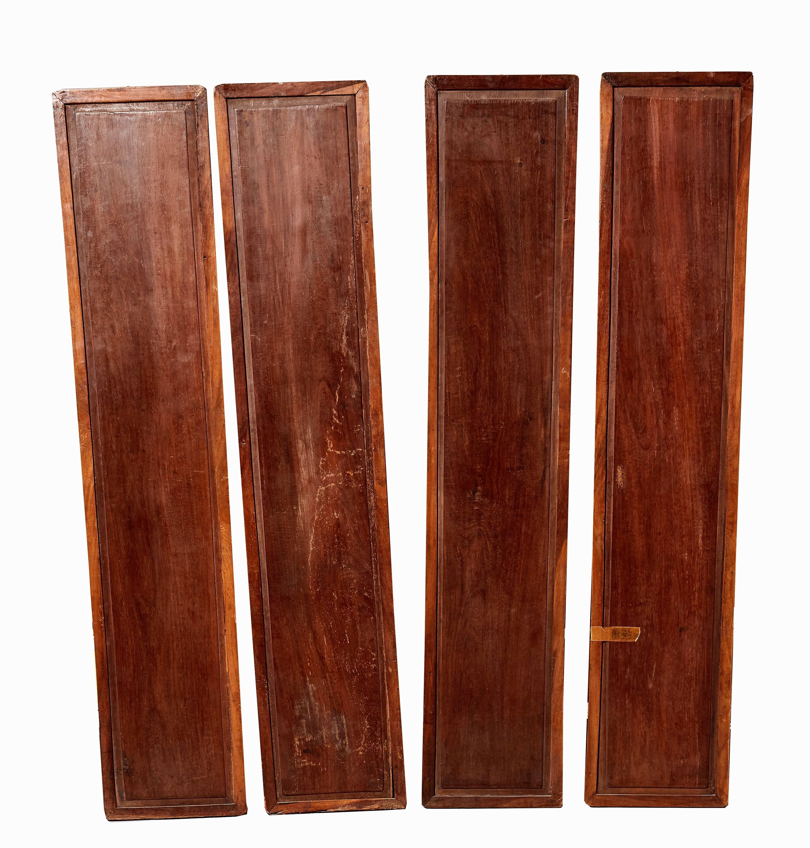 A set of four Asian wood panels with mother of pearl inlays. Some small pieces missing, 19th-20th century.