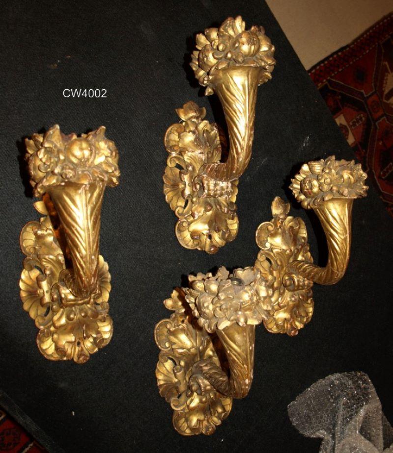 Set of four carved & gilt wood wall sconces. France, circa 1880.
Dimensions: Wall plaque height 11 1/2
