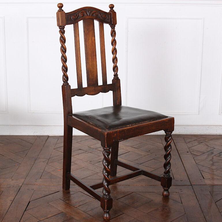 A set of four English carved oak-framed barley twist dining chairs, the backs with spiral turned supports and carved details, the legs united by an 'H' stretcher. Nice original surface with a warm patina. Drop-in seats for simple re-upholstery if