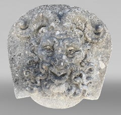Set of Four Carved Stone Medallions Depicting Satyr Faces