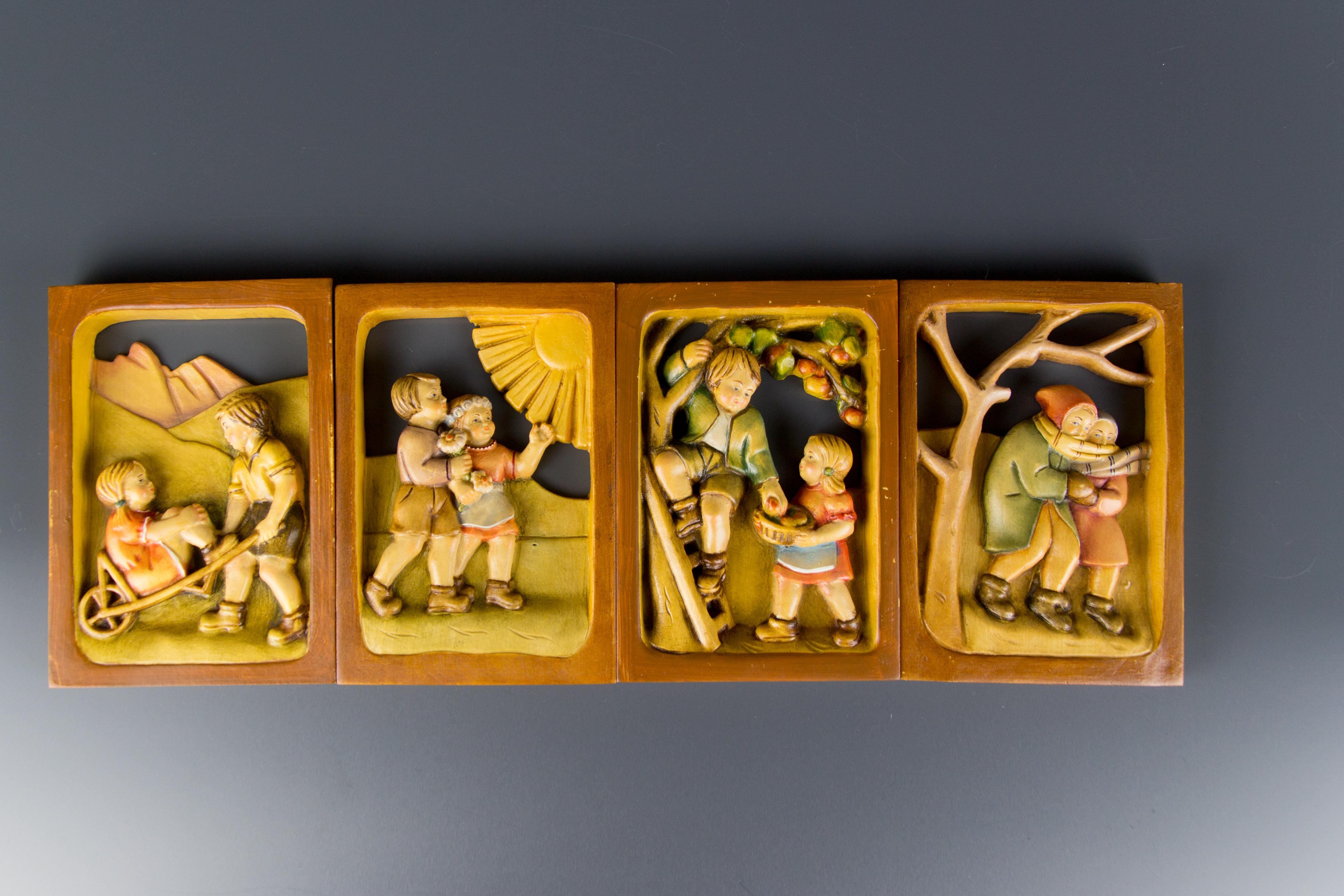 An adorable set of four wooden pictures depicting scenes of cute children in Four Seasons. Masterfully hand carved and hand painted. South-Tyrol, 1980s.
Dimensions (one picture): height 16 cm / 6.29 in; width 11 cm / 4.33 in; depth 1.5 cm / 0.59 in.