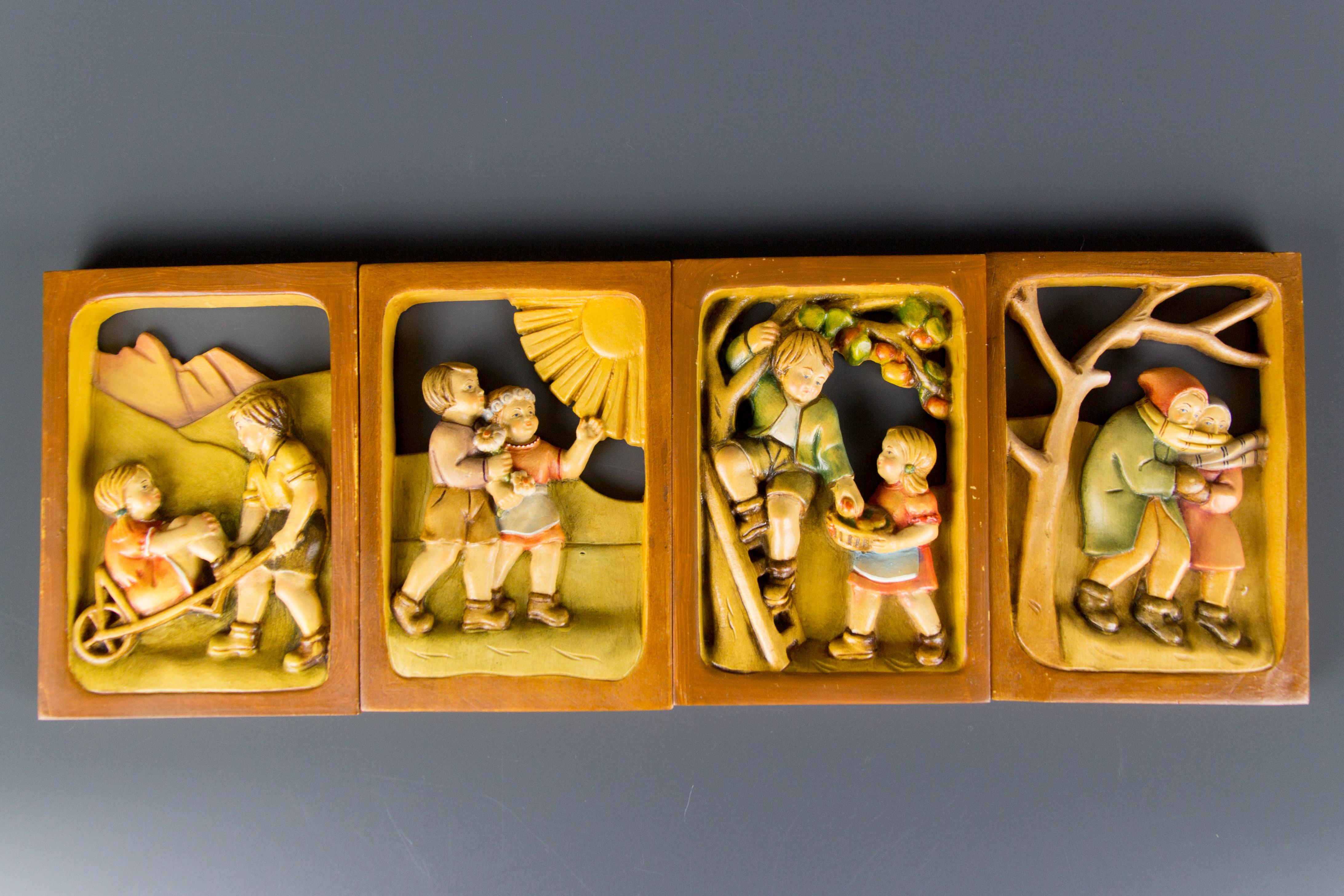 Folk Art Set of Four Carved Wooden Pictures Four Seasons For Sale