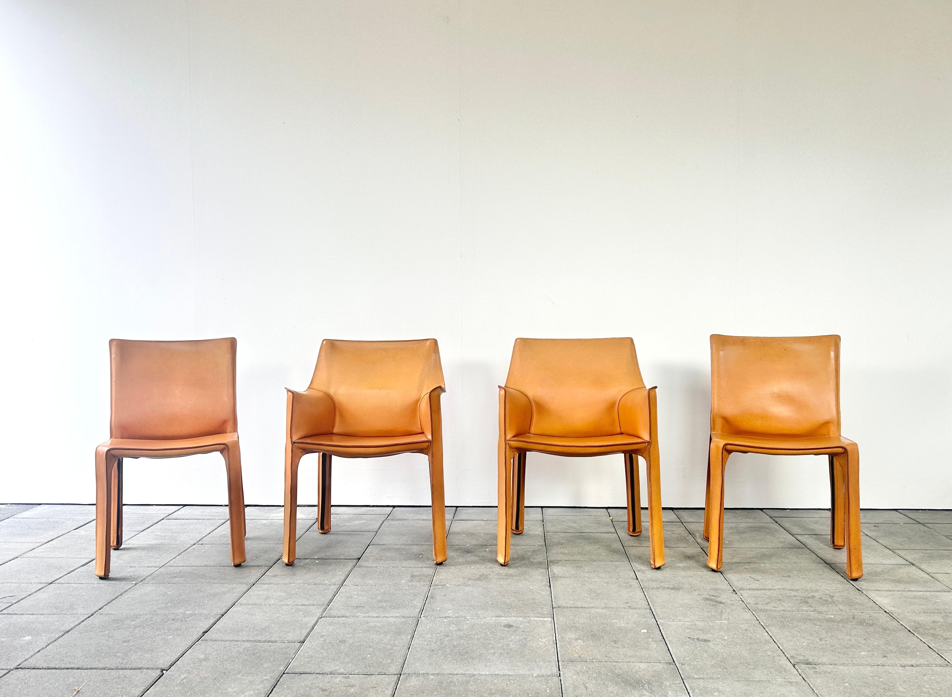 Beautiful set of four Cab Chairs in natural leather hide designed by Mario Bellini in 1976 

Manufactured by Cassina in circa 1990. 

This set consists of two cab412 dining chairs and two cab413 dining chairs with arm rests.


The Cab chair series