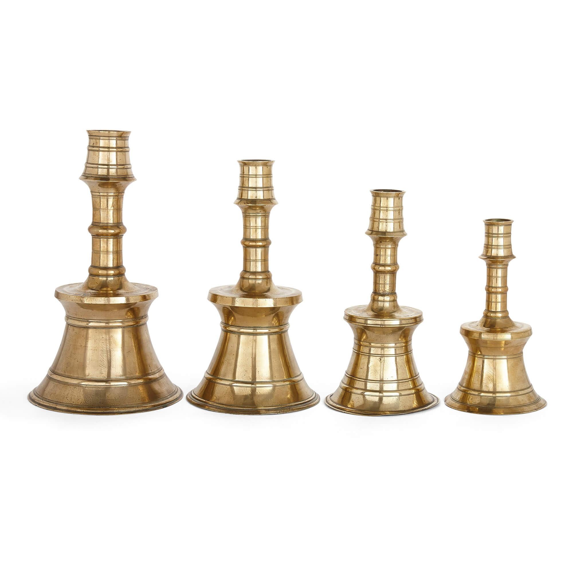 Set of four cast and turned brass ottoman candlesticks
Turkish, 16th century
Measures: Largest: Height 41.5cm, diameter 24cm
Smallest: Height 28cm, diameter 16cm

The four ottoman brass candlesticks in this set are of traditional form. Each