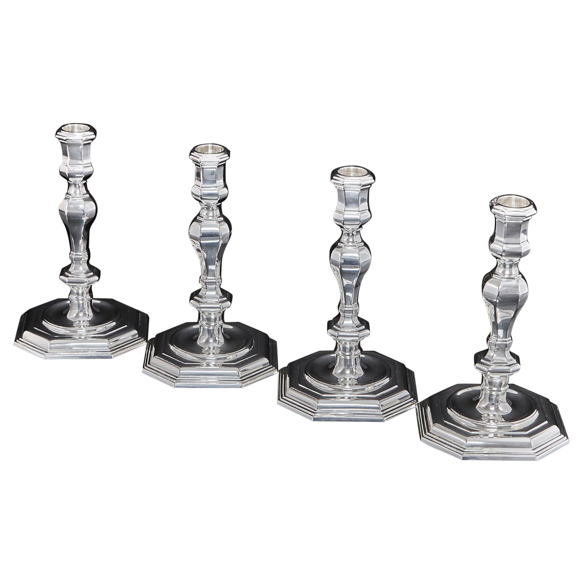 Set of Four Cast Silver Candlesticks