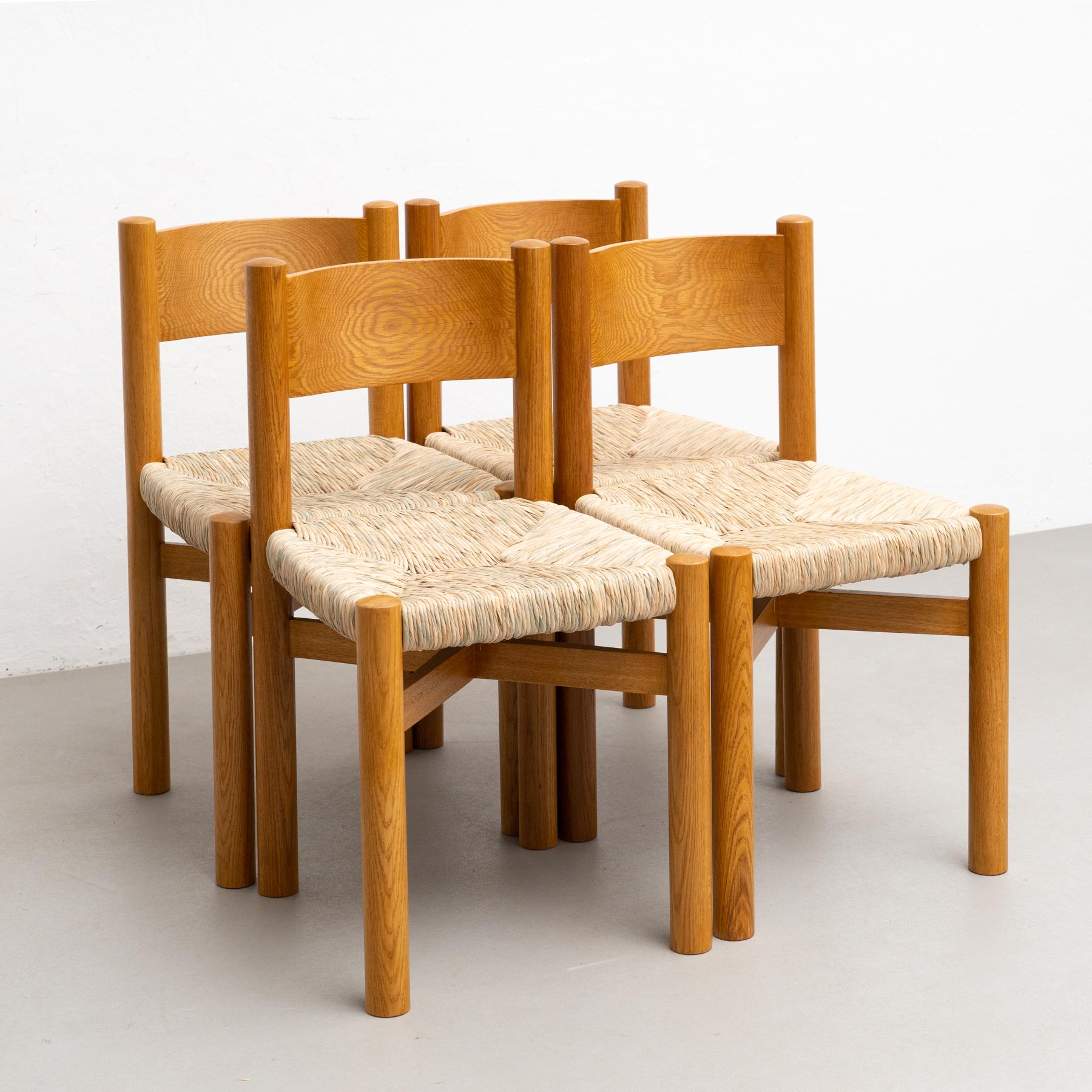 Rattan Set of Four Chairs After Charlotte Perriand For Sale
