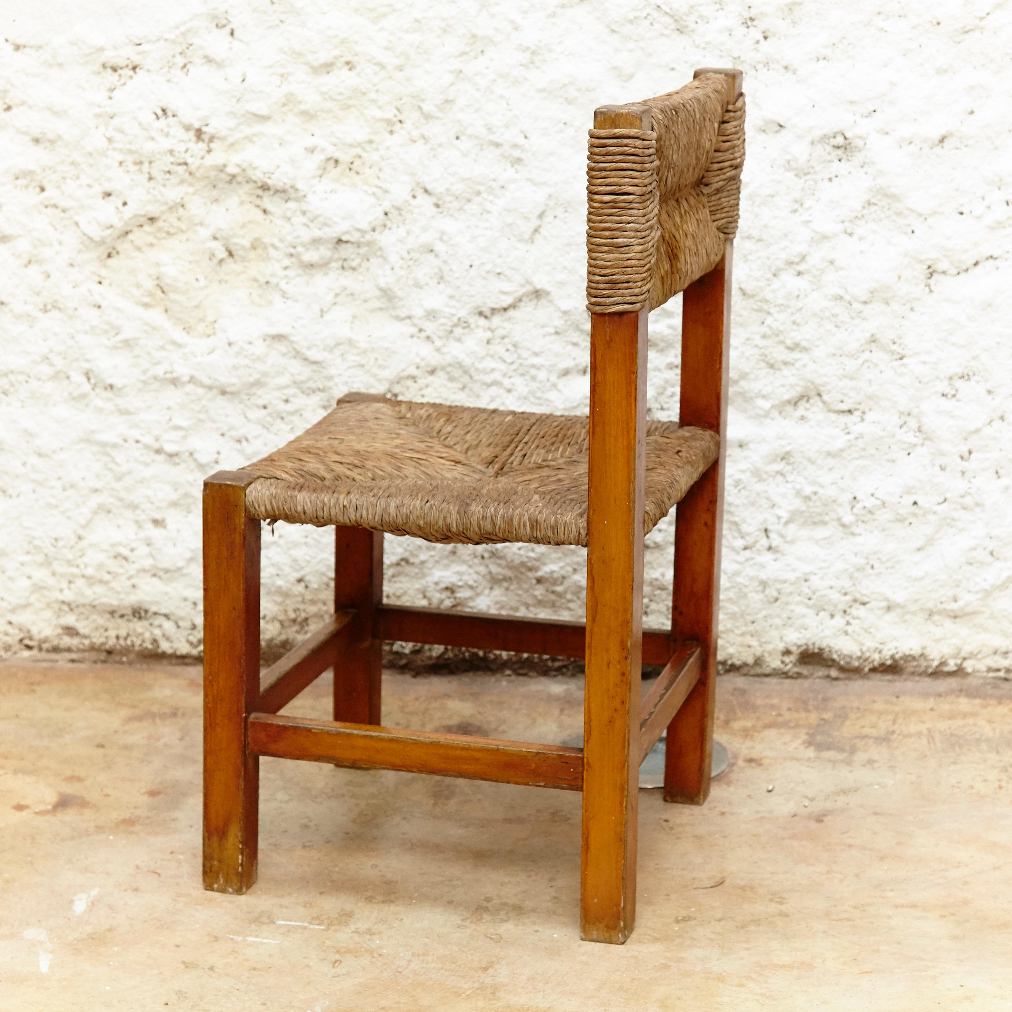 Set of Four Chairs after Charlotte Perriand in Wood and Rattan, circa 1950 4