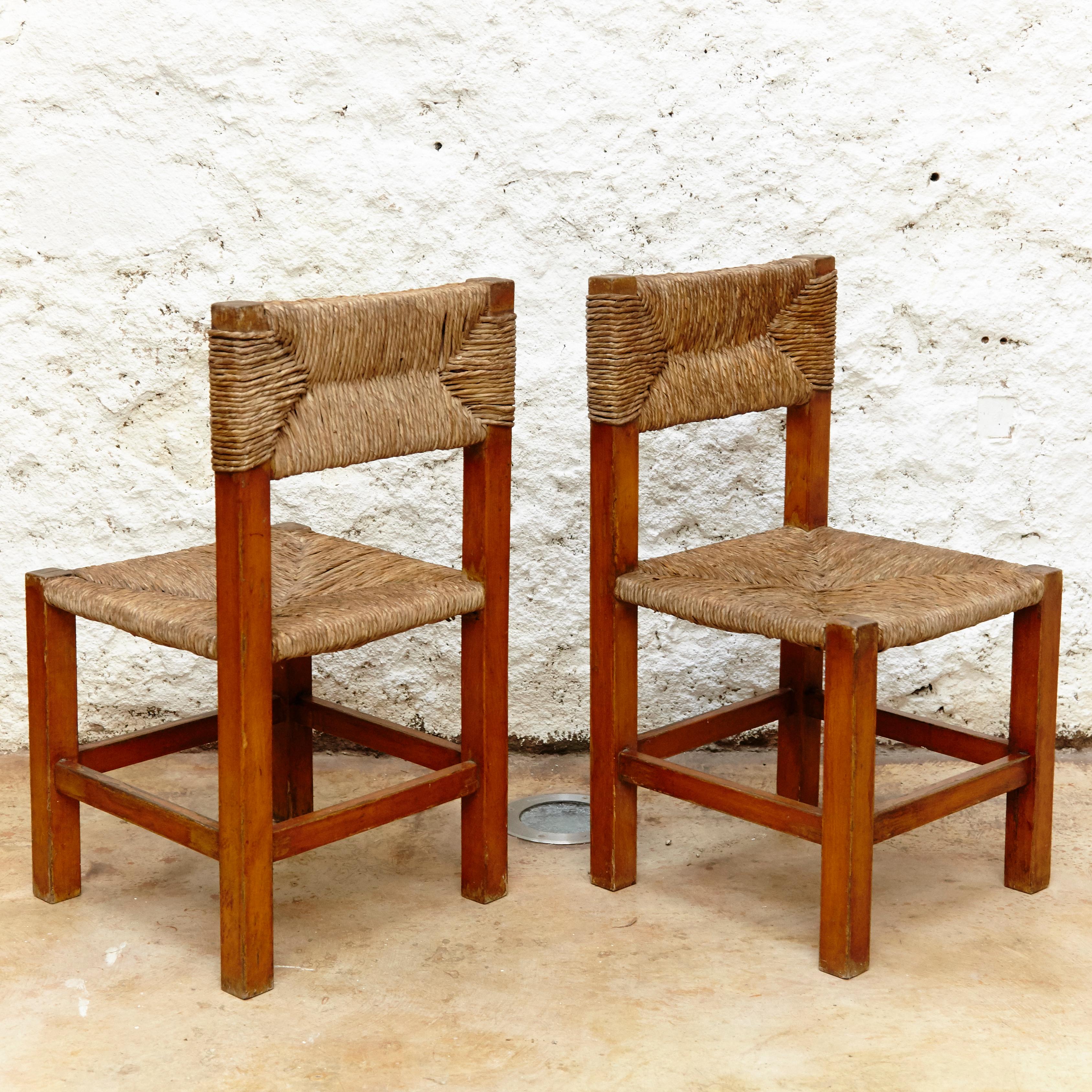 French Set of Four Chairs after Charlotte Perriand in Wood and Rattan, circa 1950