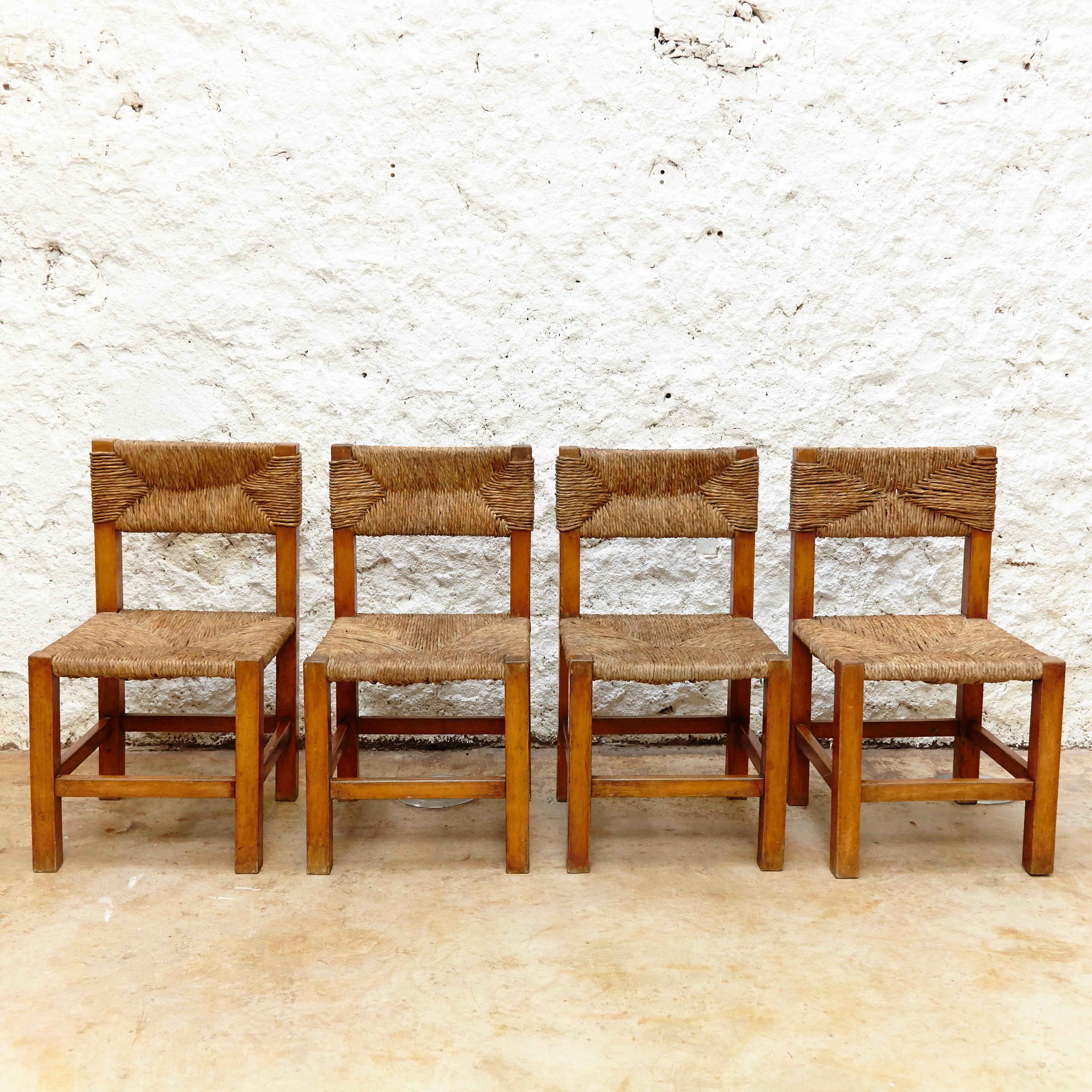 Set of Four Chairs after Charlotte Perriand in Wood and Rattan, circa 1950 In Good Condition In Barcelona, Barcelona