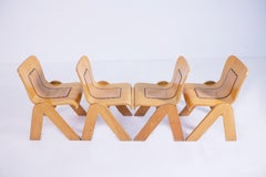 Set of Four Chairs by Gigi Babadin in Wood and Leather, 1950s