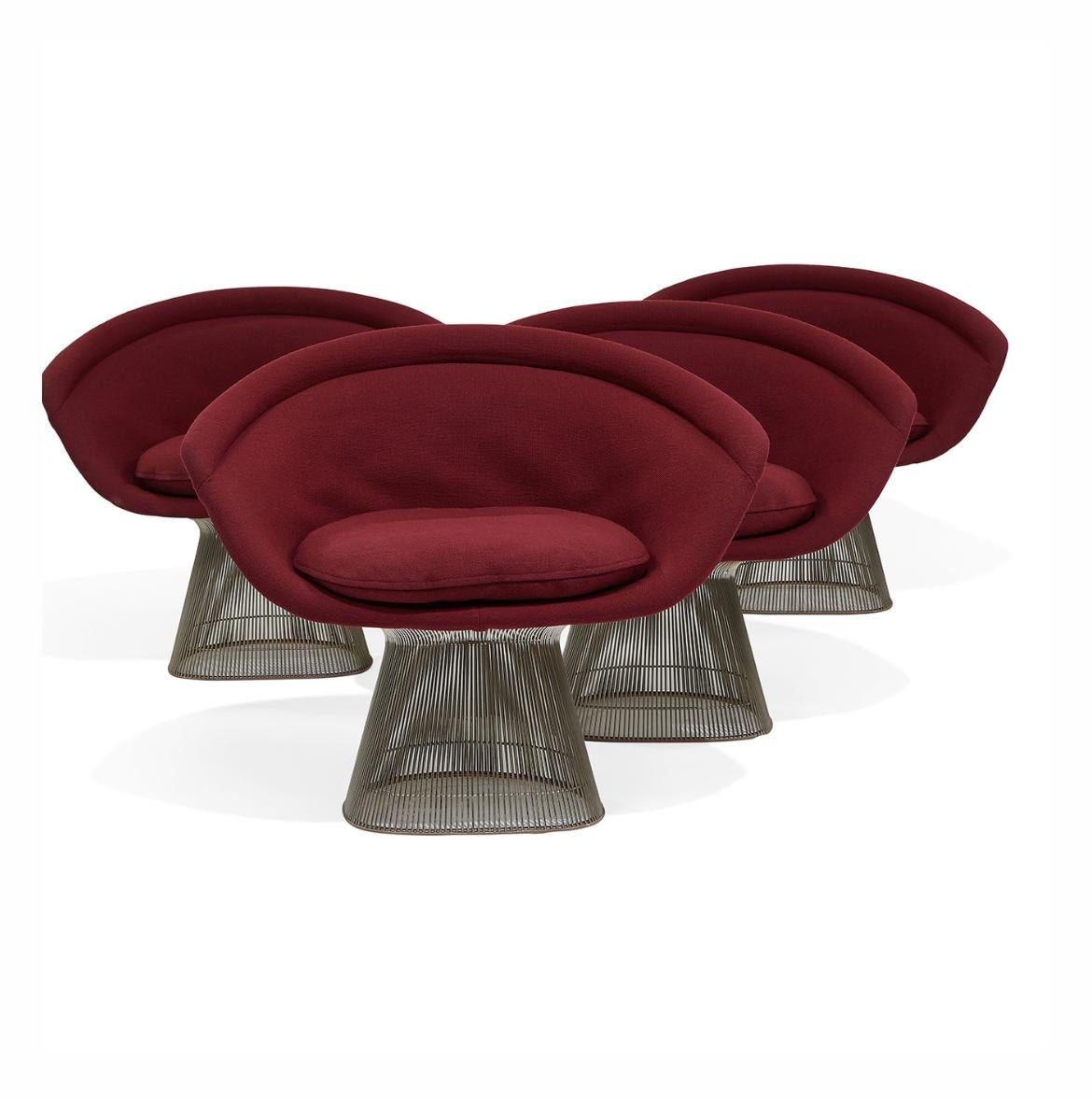 Warren Platner (1919-2006) for Knoll International, Platner Collection lounge chairs, set of four, New York, New York, 1979. Chrome-plated steel, original maroon upholstery, each with Knoll sticker and upholstery label.
 