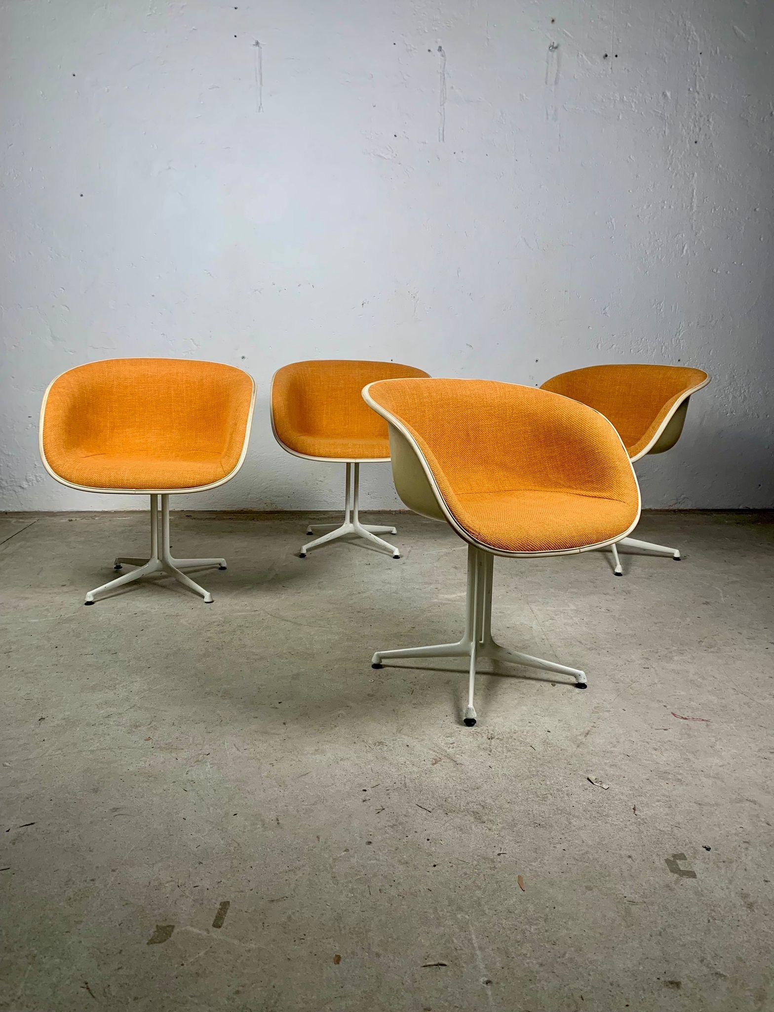 Set of four La Fonda chairs by Charles Eames, 1960s. 

Set of chairs fibreglass shell, upholstered fabric seat, painted aluminium feet.
This chair is one of two new fibreglass chairs that Charles and Ray Eames designed in 1961 at the request of