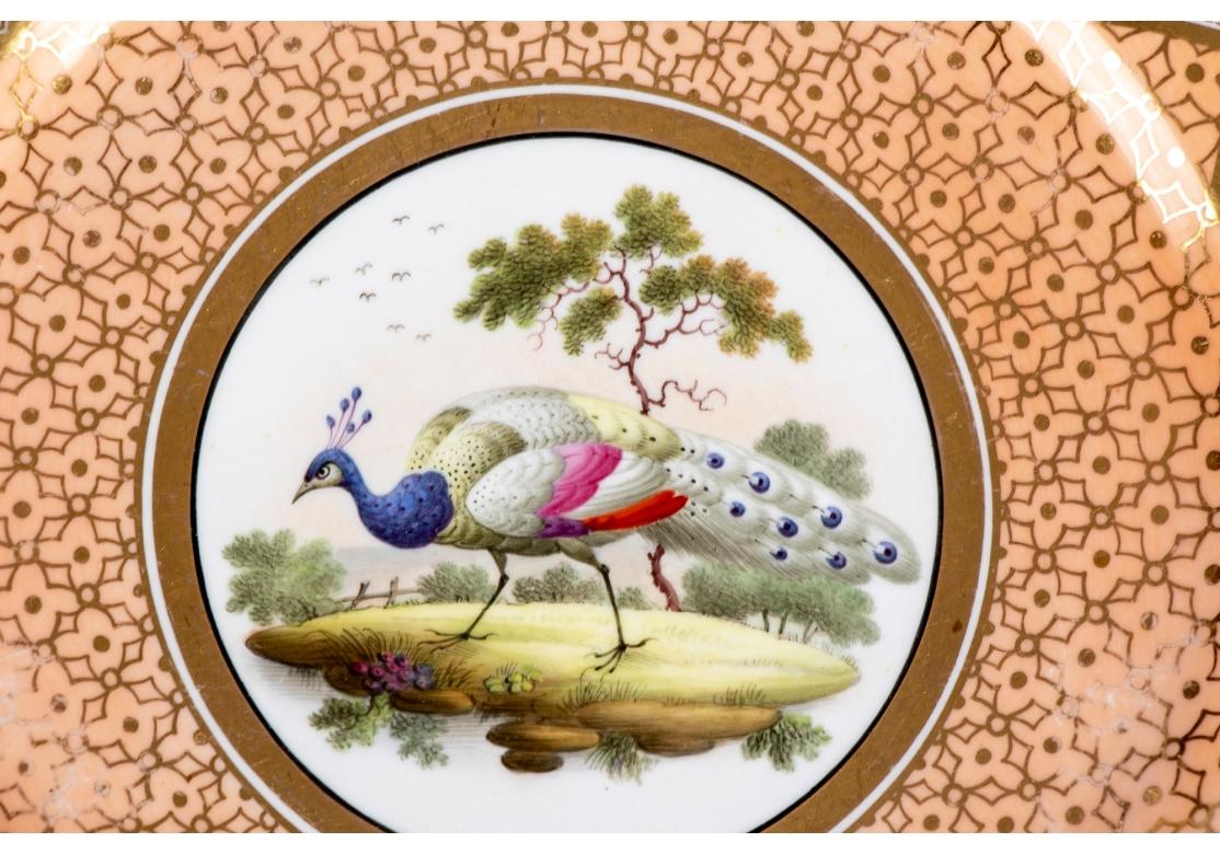 Georgien Ensemble de quatre assiettes en porcelaine de Chamberlain Worcester avec oiseaux exotiques