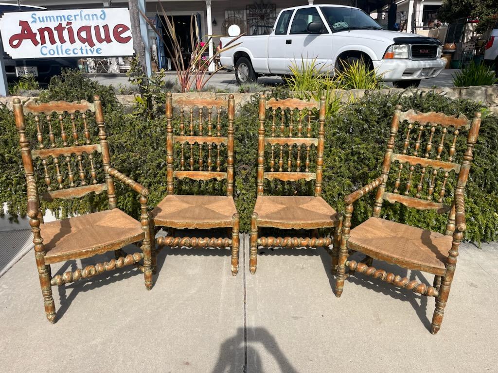 These hand crafted chairs and hand painted chairs have hand rushed seats and in fine sturdy condition.This set of four chairs are two arm chairs and two regular chairs.