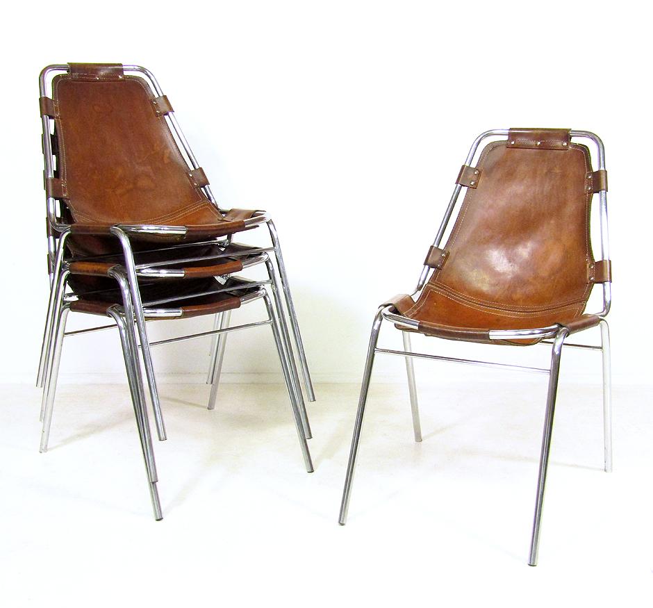 A set of four 1960s hide and chromed steel chairs by Cassina, as selected by Charlotte Perriand for the 