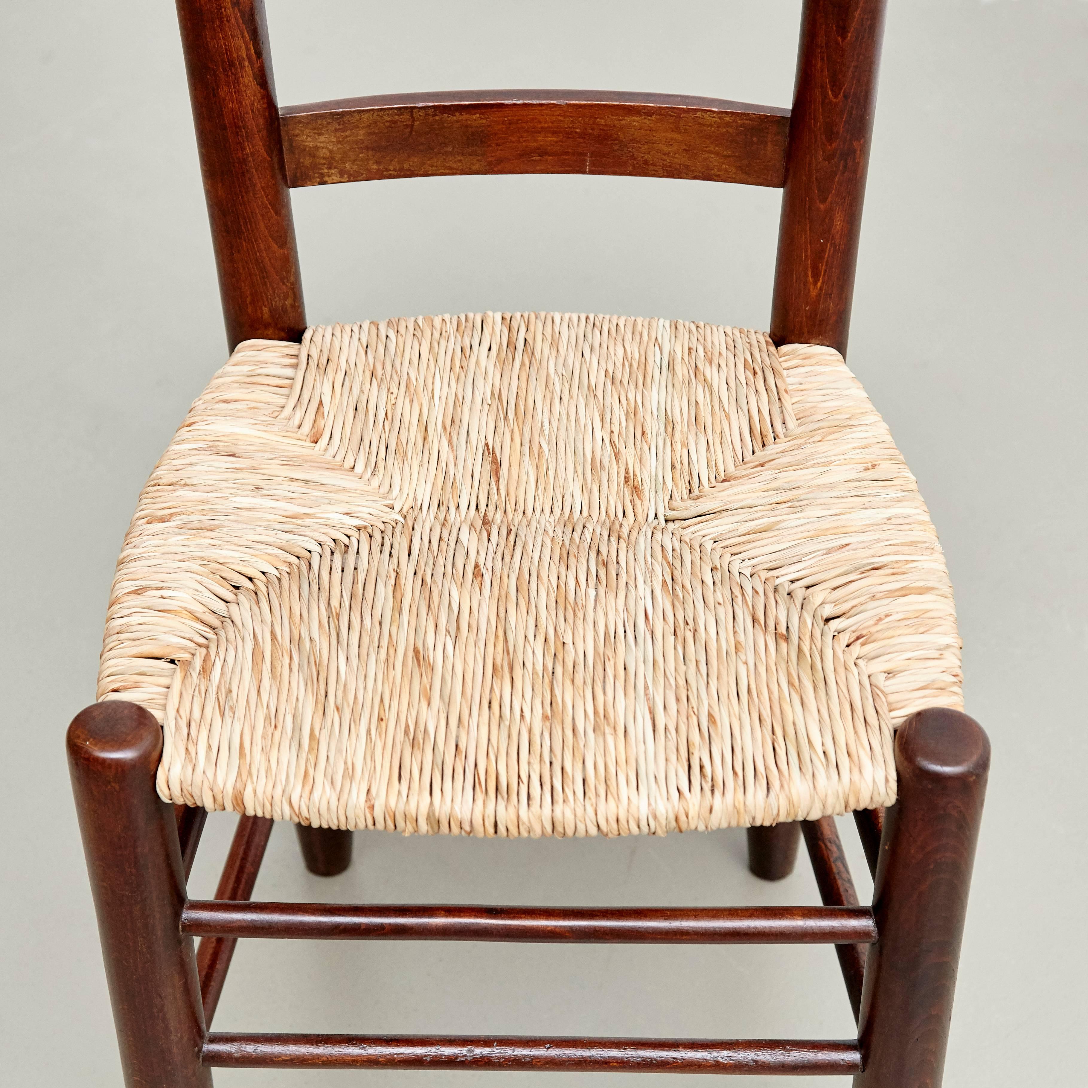 Mid-20th Century Set of Four Charlotte Perriand Mid-Century Modern Wood Rattan FrenchNº 19 Chairs