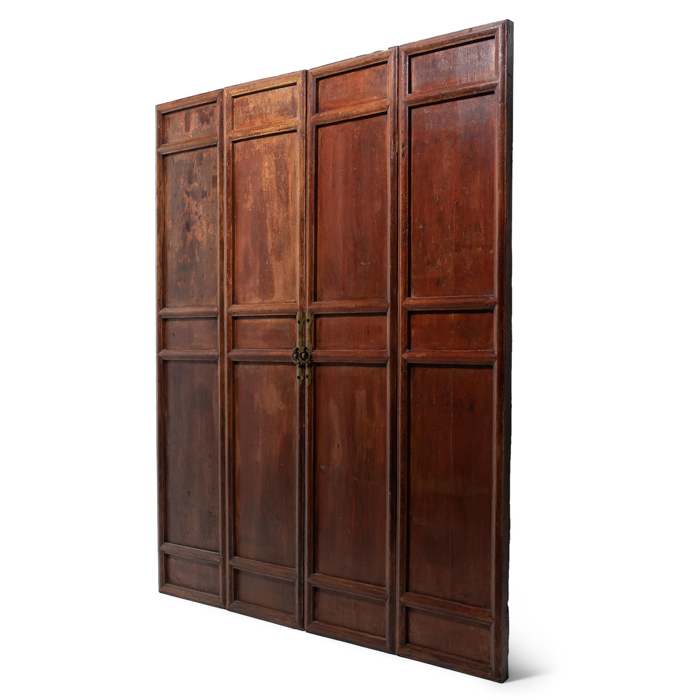 A hallmark of Chinese architecture, tall door panels such as these were used in provincial courtyard homes to easily open up a room to the outdoors. Designed with solid wood panels instead of lattice windows, these door panels were likely installed