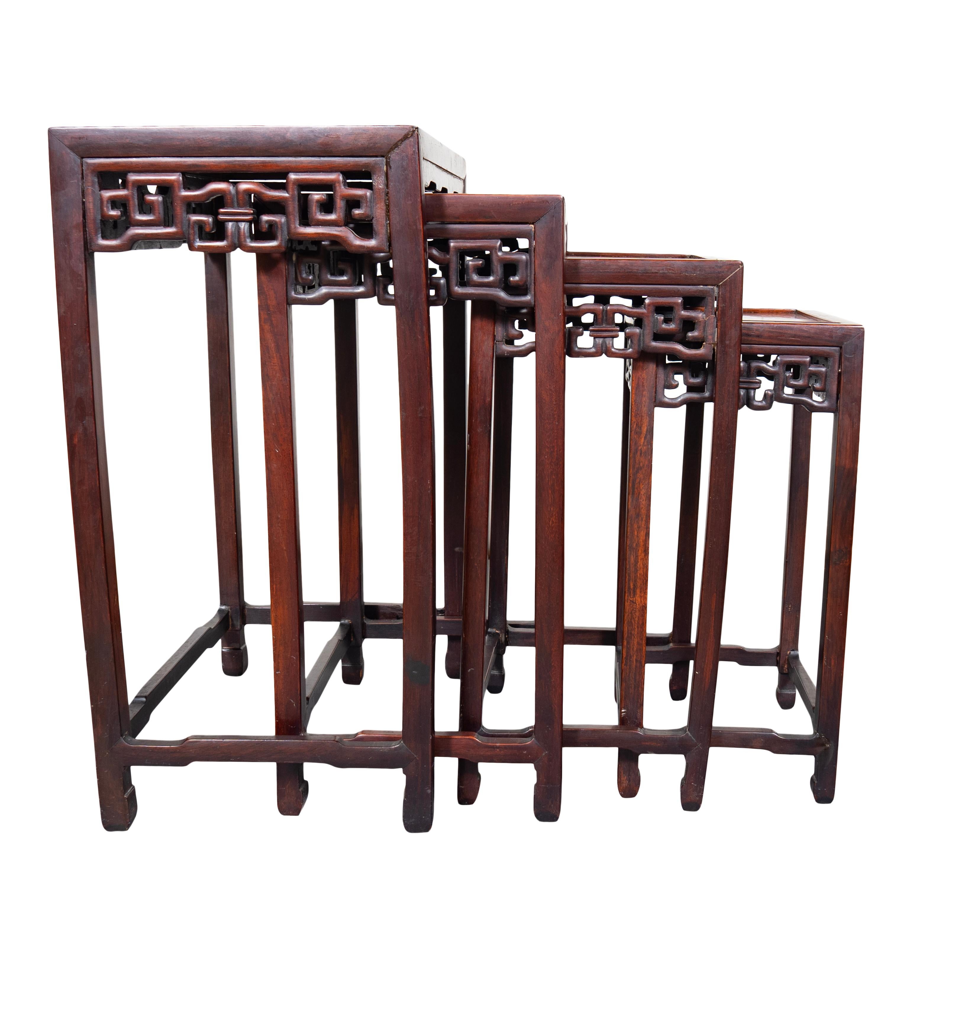 Four tables each with a burled wood top. Carved ruyi design aprons and square legs .