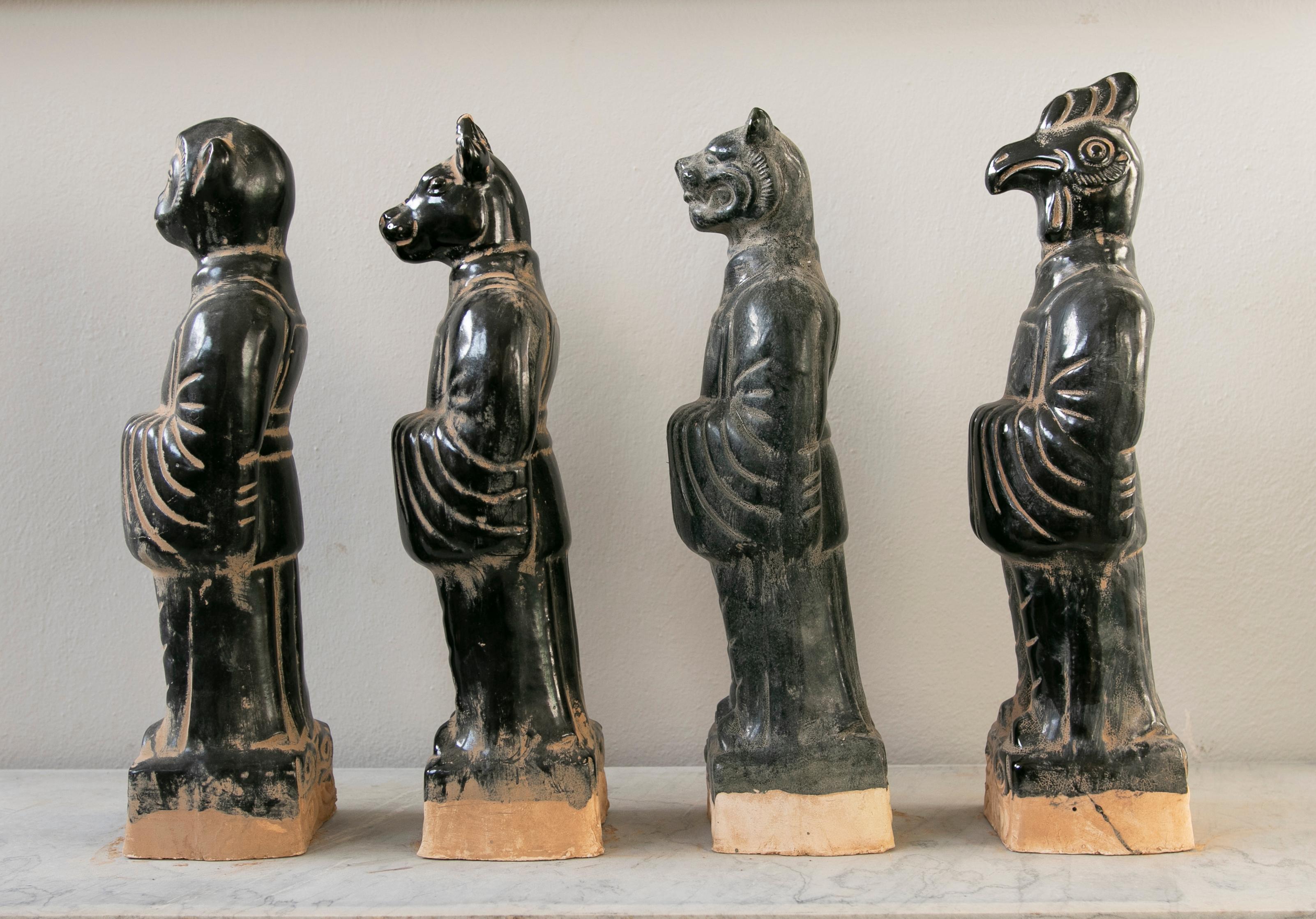 Set of four Chinese mythological gods in black Glazed Terracotta.