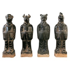 Set di quattro divinità mitologiche cinesi in terracotta smaltata nera