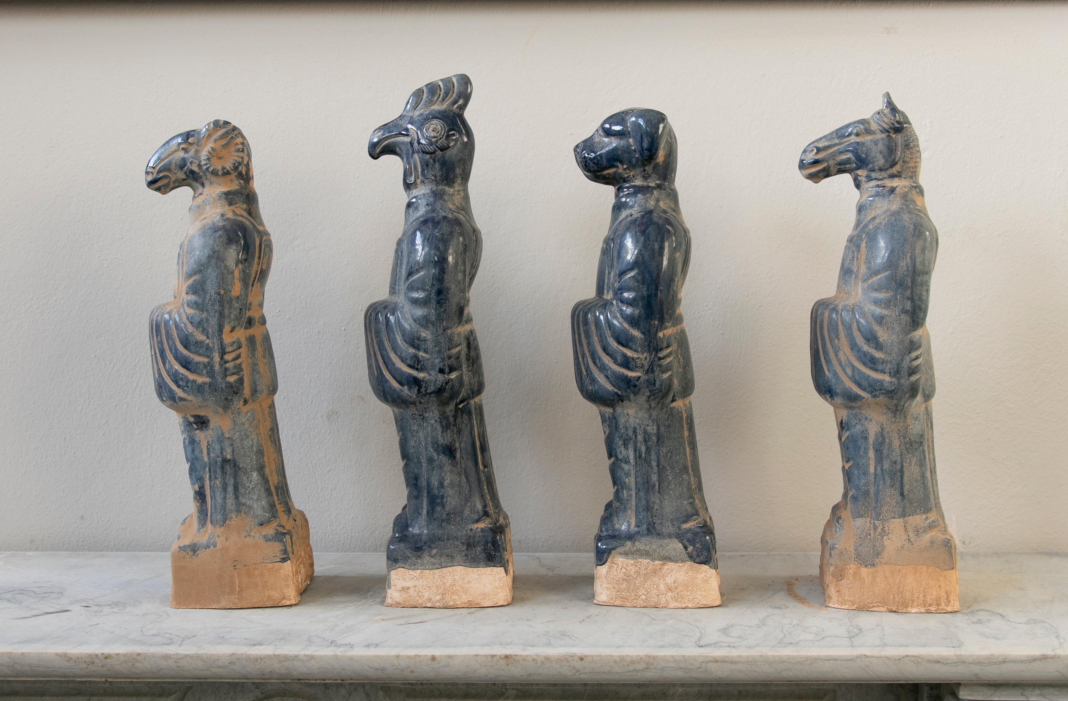 Set of Four Chinese Mythological Gods in Blue Glazed Terracotta.