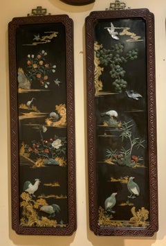 Set of four Chinese panels  with hard stones and jade inset in carved frames