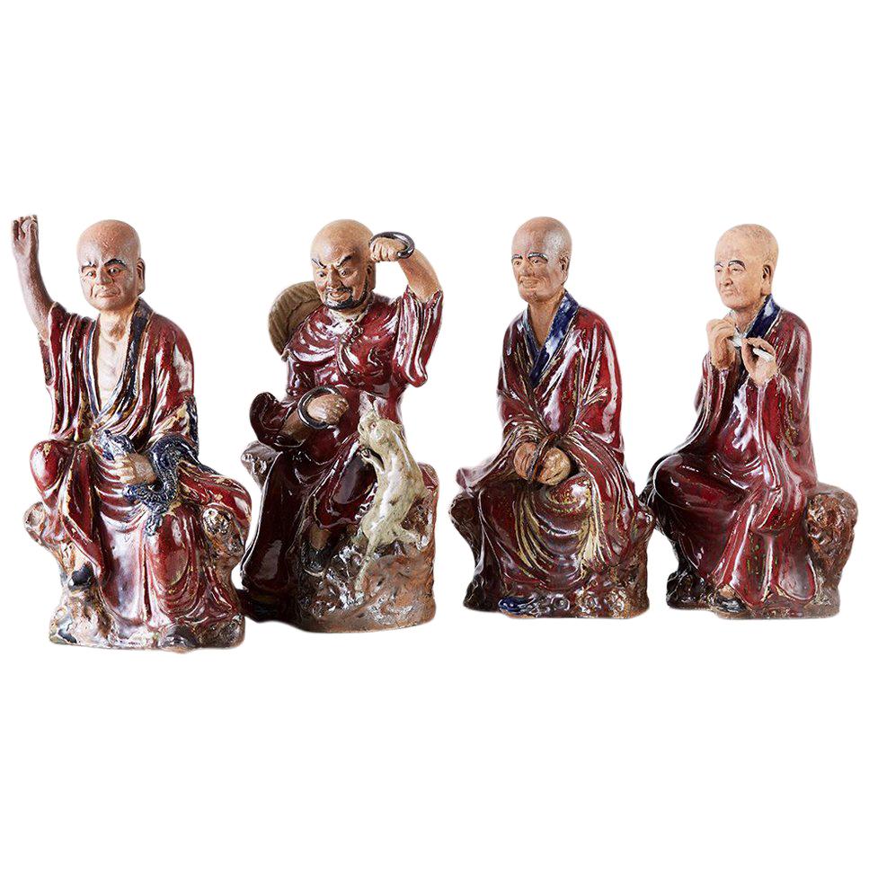 Ensemble de quatre divinités immortelaires chinoises en poterie de Shiwan