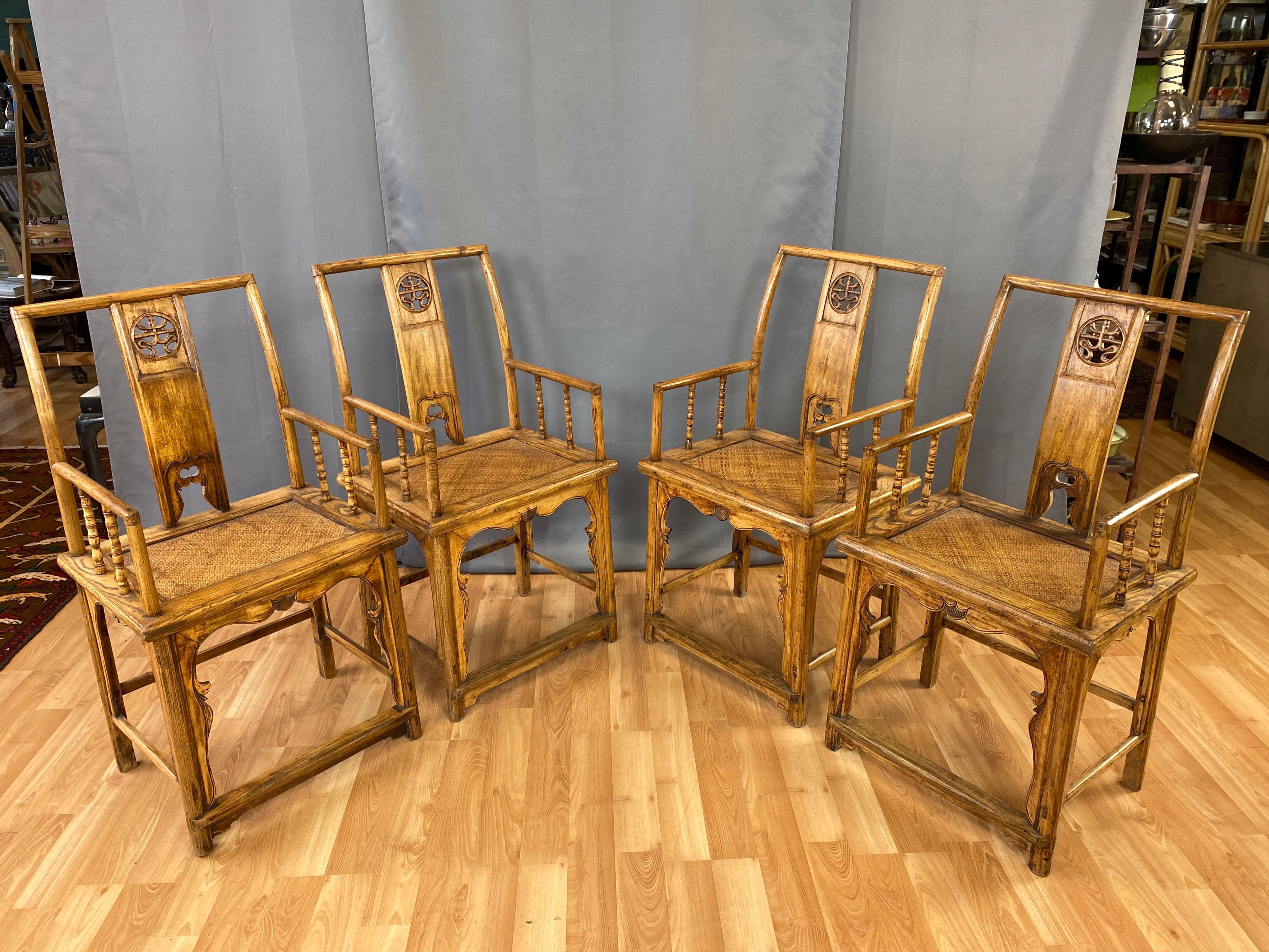 A fine set of four circa 1900 Qing dynasty Southern official’s hat armchairs in elm.

Very handsome and well crafted solid elm wood frame distinguished by open carved back splat medallion, elegantly sculpted skirting, and bamboo-motif turned wood