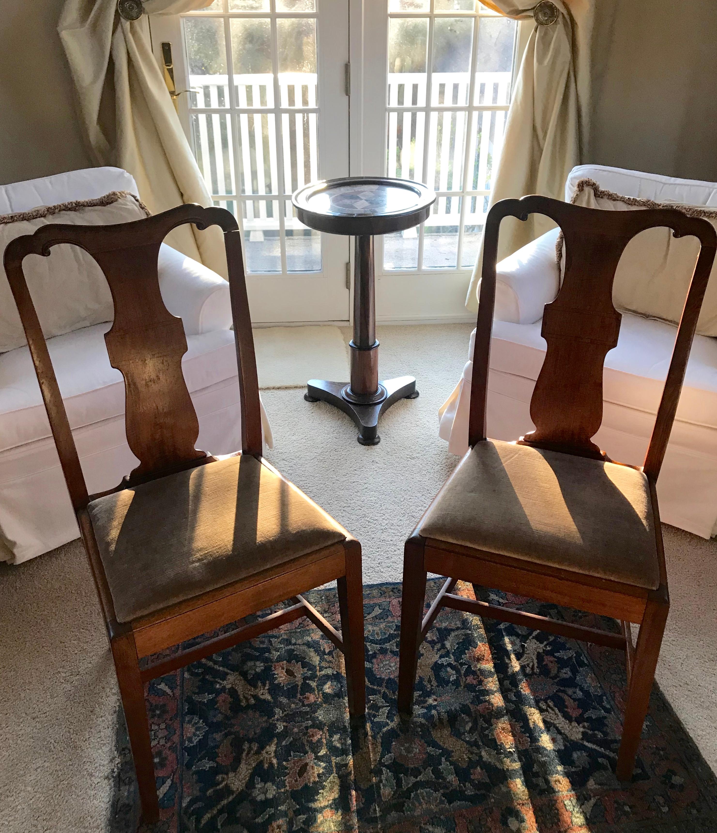 Set of four Chippendale style splat back side chairs. Set of four-light mahogany vasiform splat back side chairs with straight front legs, slight saber rear legs all joined by simple stretcher to sides and middle; with later linen velvet seat,