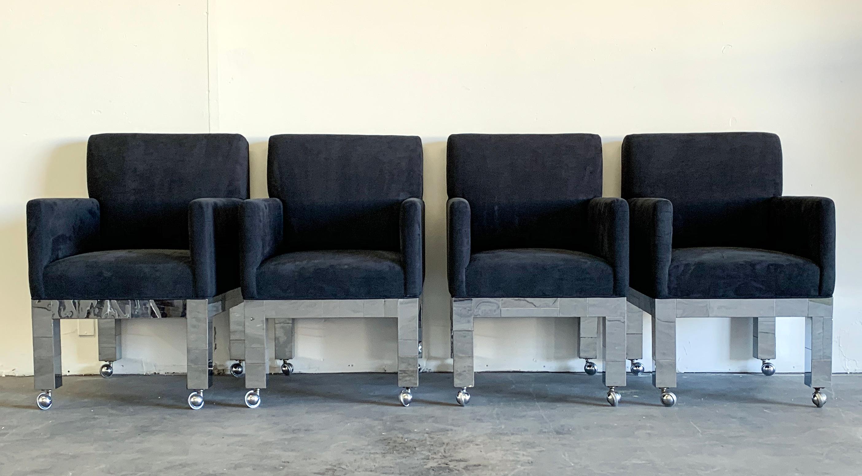 A stunning and rare set of 4 chrome cityscape chairs by Paul Evans for Directional. This matched set of PE-241 arm chairs are upholstered in a supple black matte ultrasuede and feature Evans' signature chrome patchwork  design.

These gorgeous Paul