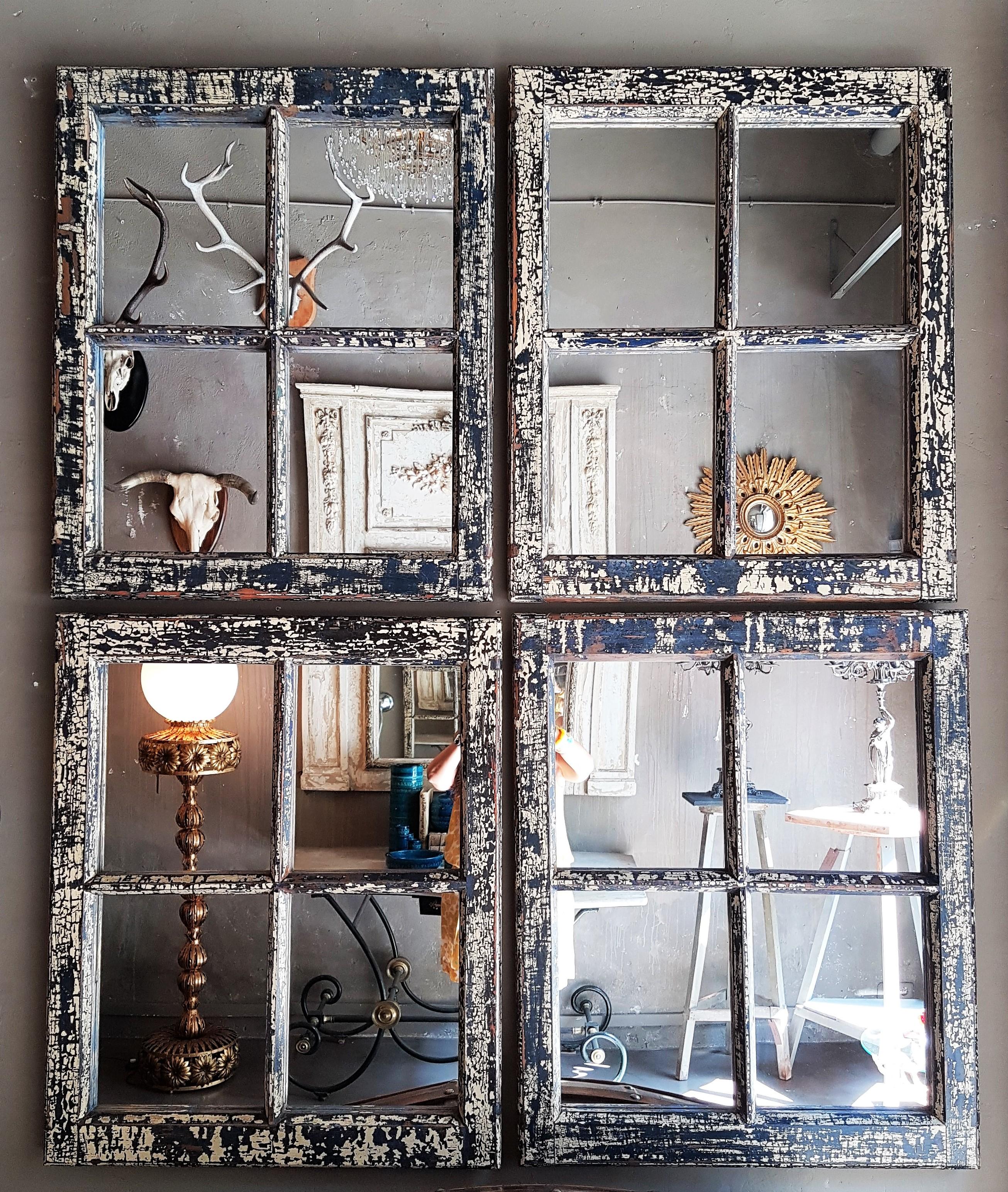 Set of Four Classic Blue and Ecru Patina Industrial Wooden Window Frame Mirrors.  Spain, 19th century.
These wood window frames have an interesting original patina showing rests of different coats of paint,
All of them have their original colors