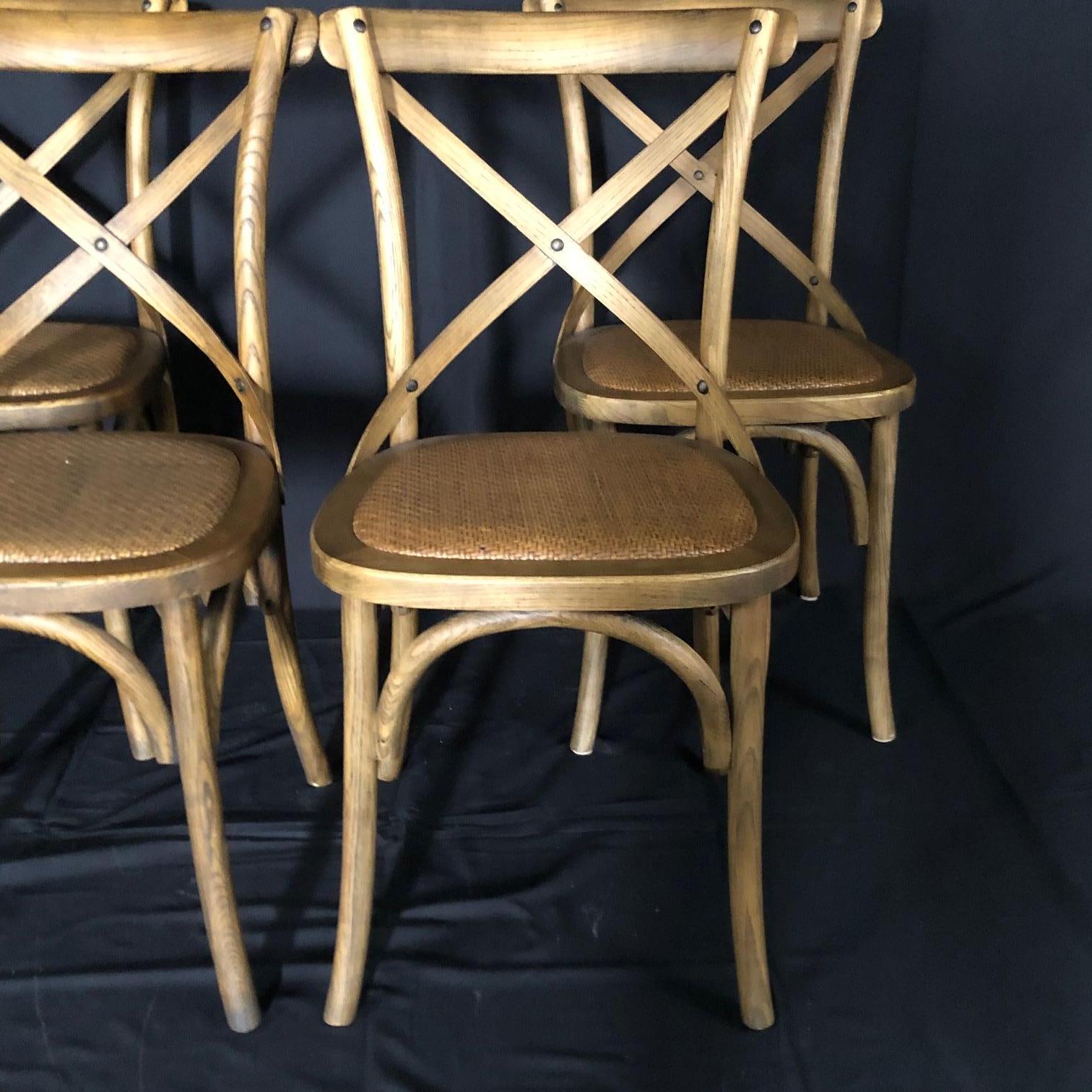 This set of four bentwood French bistro or café chairs have Classic campaign style and beautiful woven caned seats. The bentwood design is Classic and elegant.

 #5107.