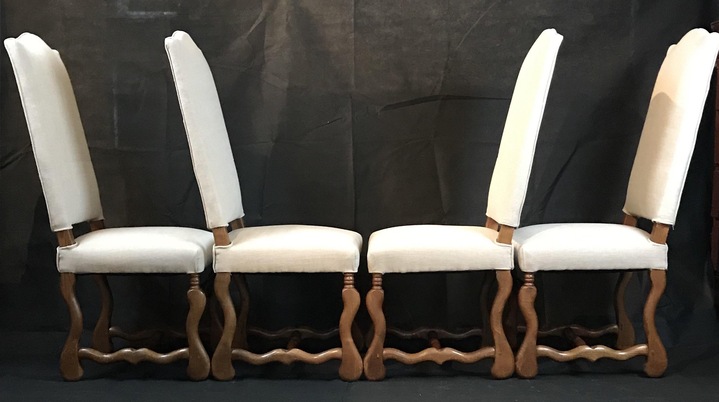 Set of four classic Os de Mouton French dining chairs, circa 1920s. Carved walnut frames and newly upholstered in a neutral linen weave cotton blend fabric. All chairs are armless. 


Dimensions: H 46.5” x H to seat 18.5” x W 19.5” x D 19”.