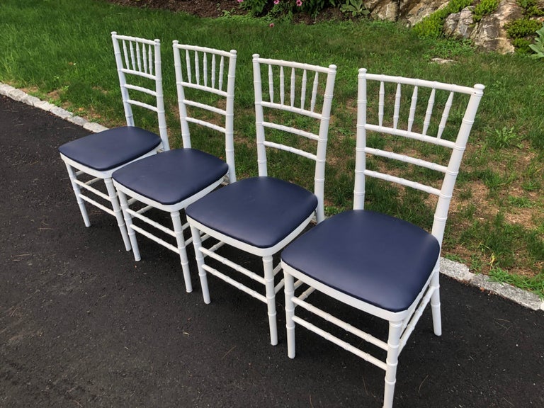 Contemporary Set of Four Classic White Wooden Chiavari Chairs with Navy Seats For Sale