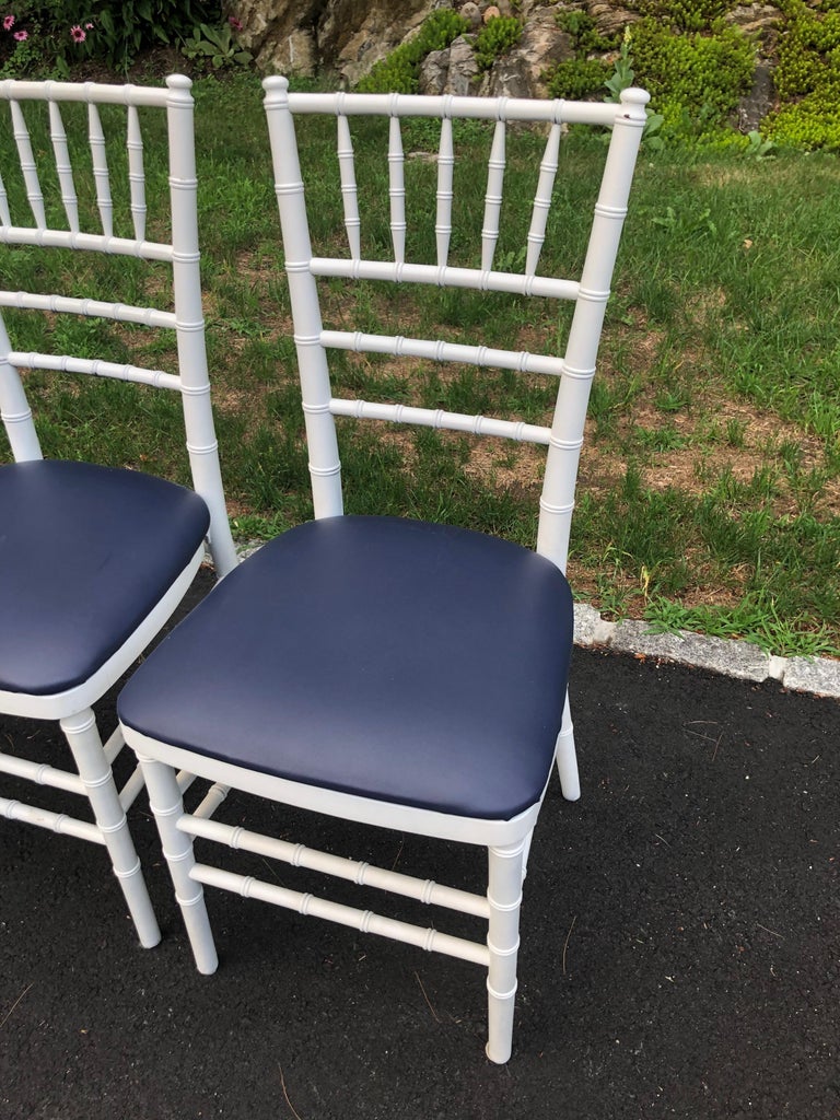 Faux Leather Set of Four Classic White Wooden Chiavari Chairs with Navy Seats For Sale