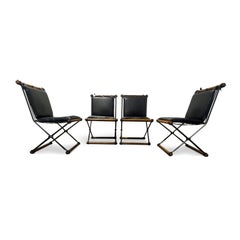 Juego de cuatro sillas de hierro forjado Cleo Baldon