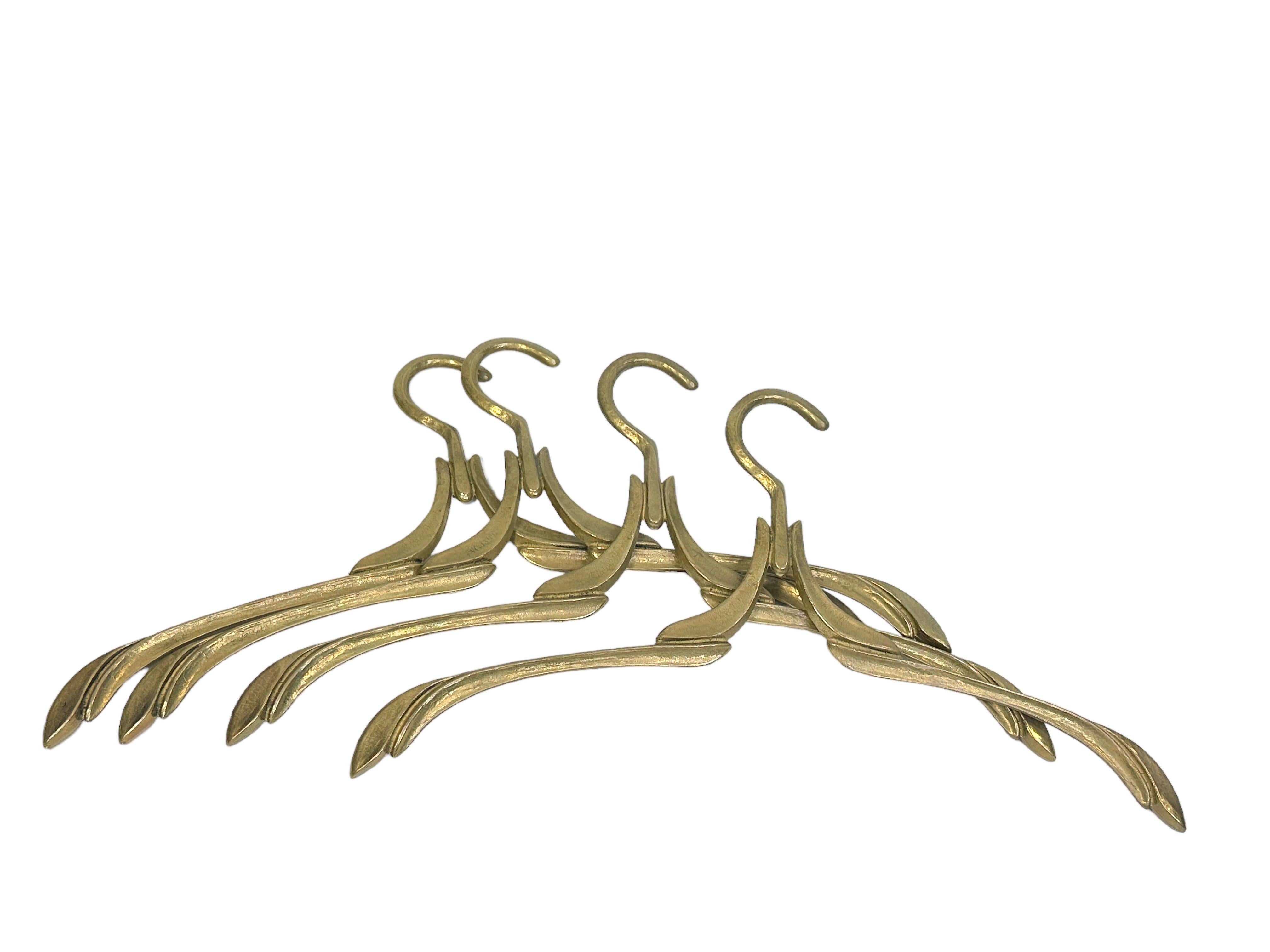 A set of four beautiful vintage hangers made of solid brass with a lovely patina.
A very special dress deserves a very special hanger. Made of solid brass, these vintage hangers are in very good condition. The perfect addition to your boudoir or