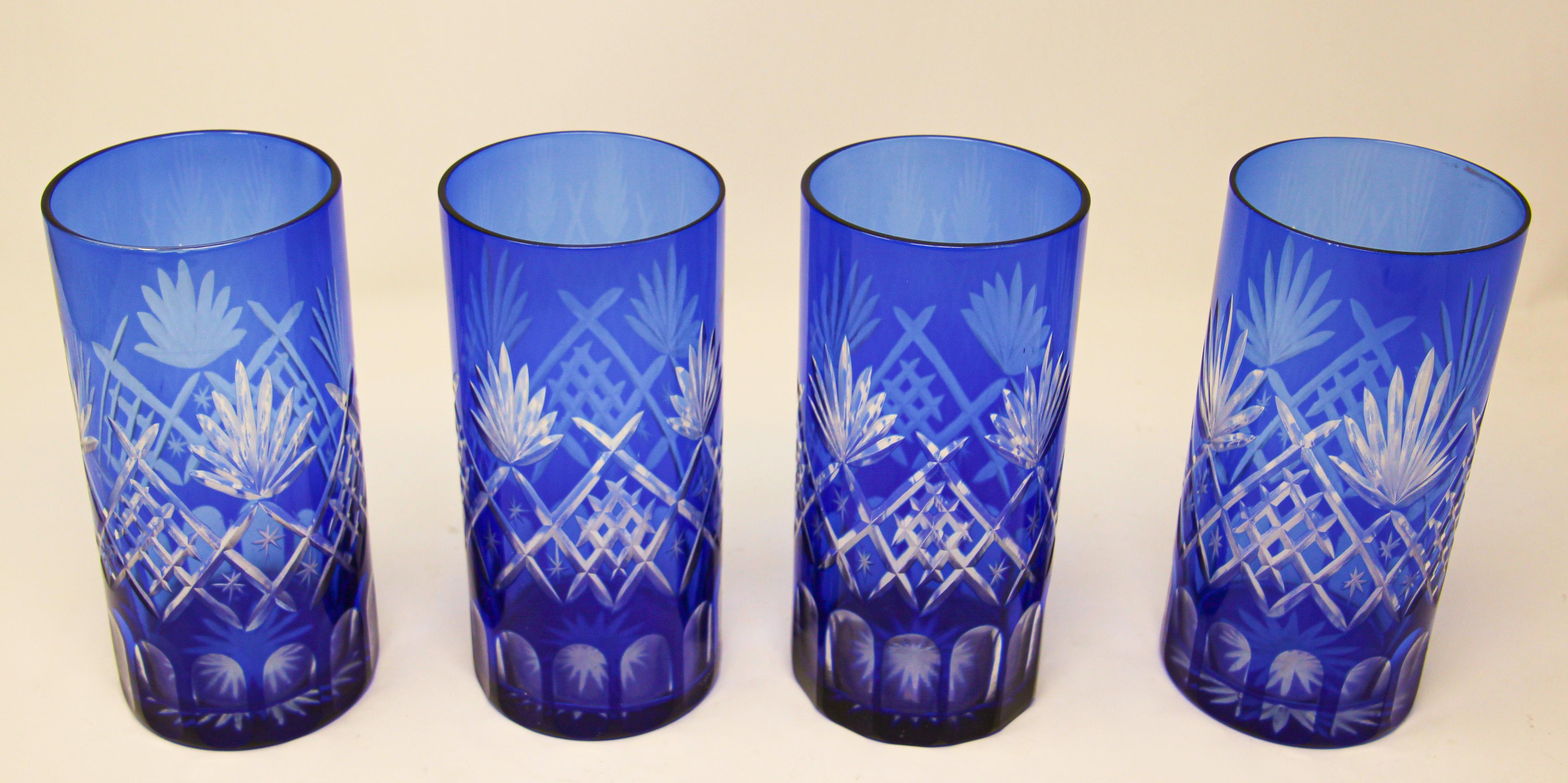 Set of four highball cobalt blue crystal glasses.
Exquisite Bohemian crystal style cut Czech drinking rock glasses tumbler set of four.
The vibrant hand blown rich sapphire blue jewel sapphire blue crystal glass is cut to clear to reveal a lovely