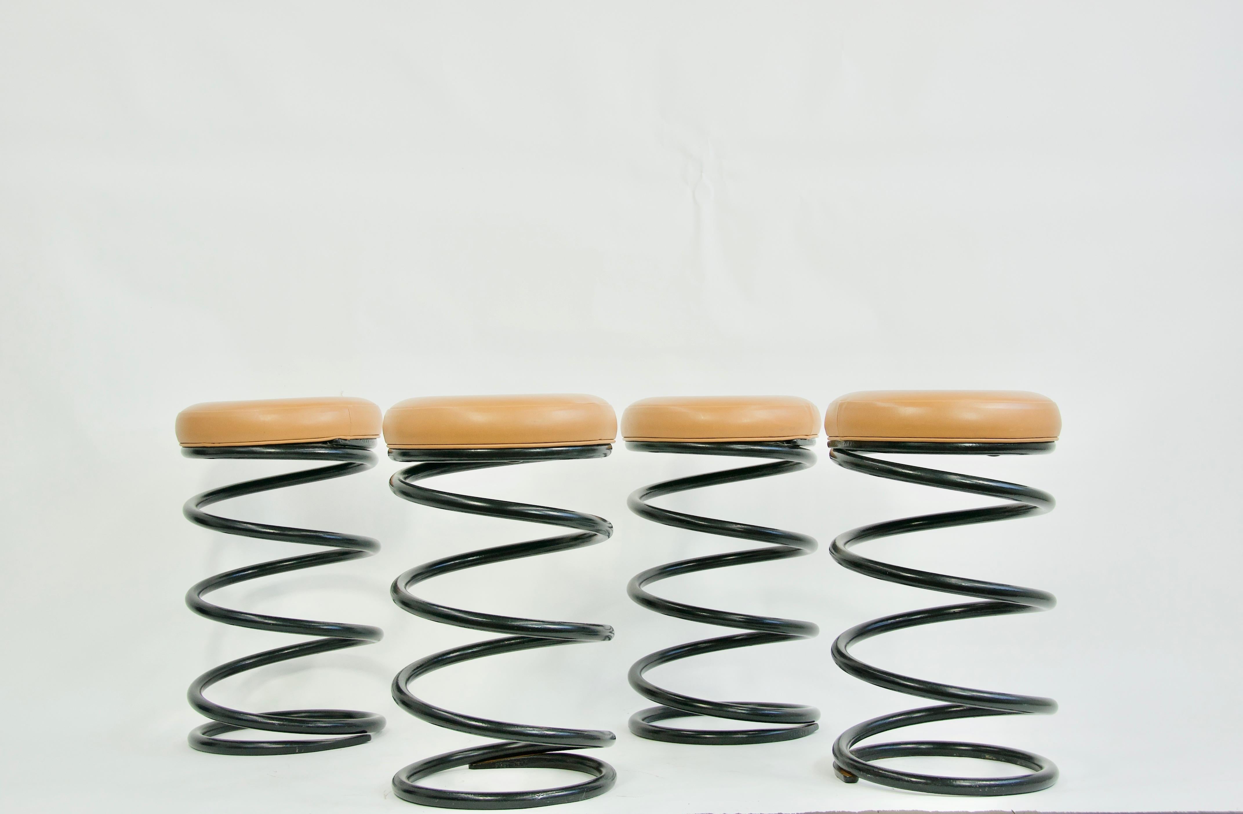 Set of four industrial coil spring barstools. Heavy steel spring coil with vinyl seats.