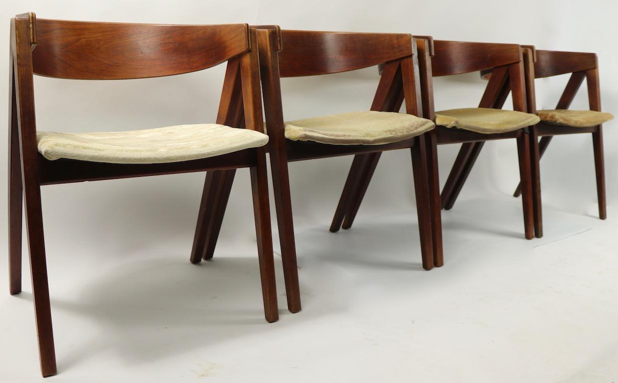 Hard to find form, Classic midcentury compass chairs, by Allan Gould. Four chairs offered and priced as a set, all show some cosmetic wear to finish, and will need to be reupholstered. Great architectural style, sophisticated, and chic design.